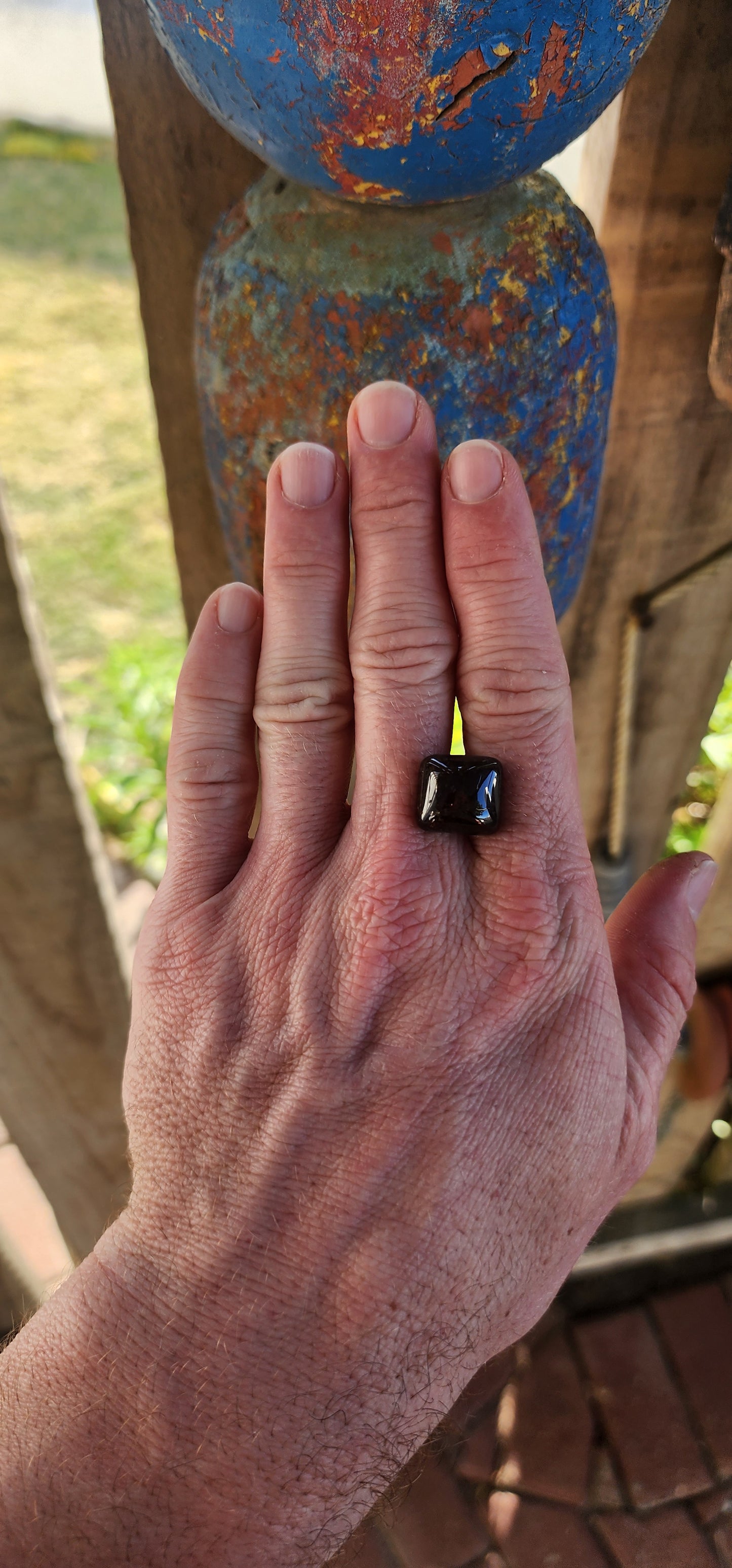 Behold this generous, dark burnt-orange tourmaline cabochon, masterfully shaped in the coveted sugar-loaf cut—a style treasured since ancient times for its softly domed peak and rounded geometric form.