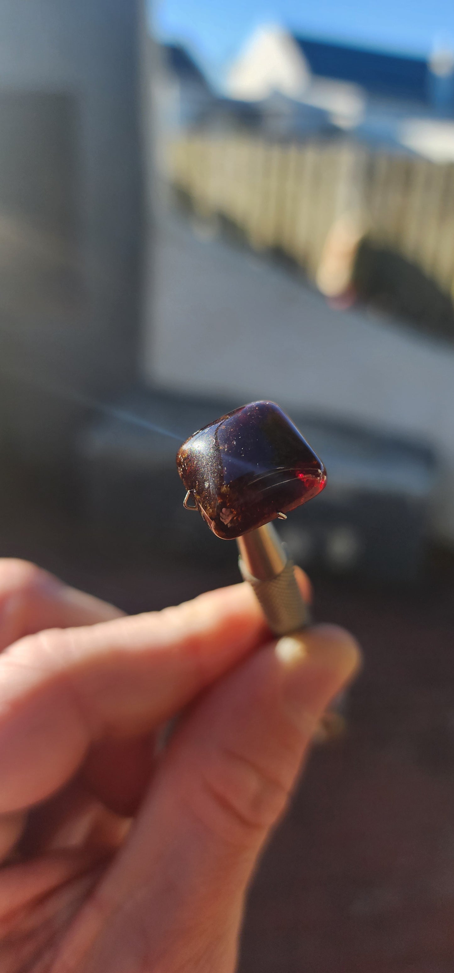 Behold this generous, dark burnt-orange tourmaline cabochon, masterfully shaped in the coveted sugar-loaf cut—a style treasured since ancient times for its softly domed peak and rounded geometric form.