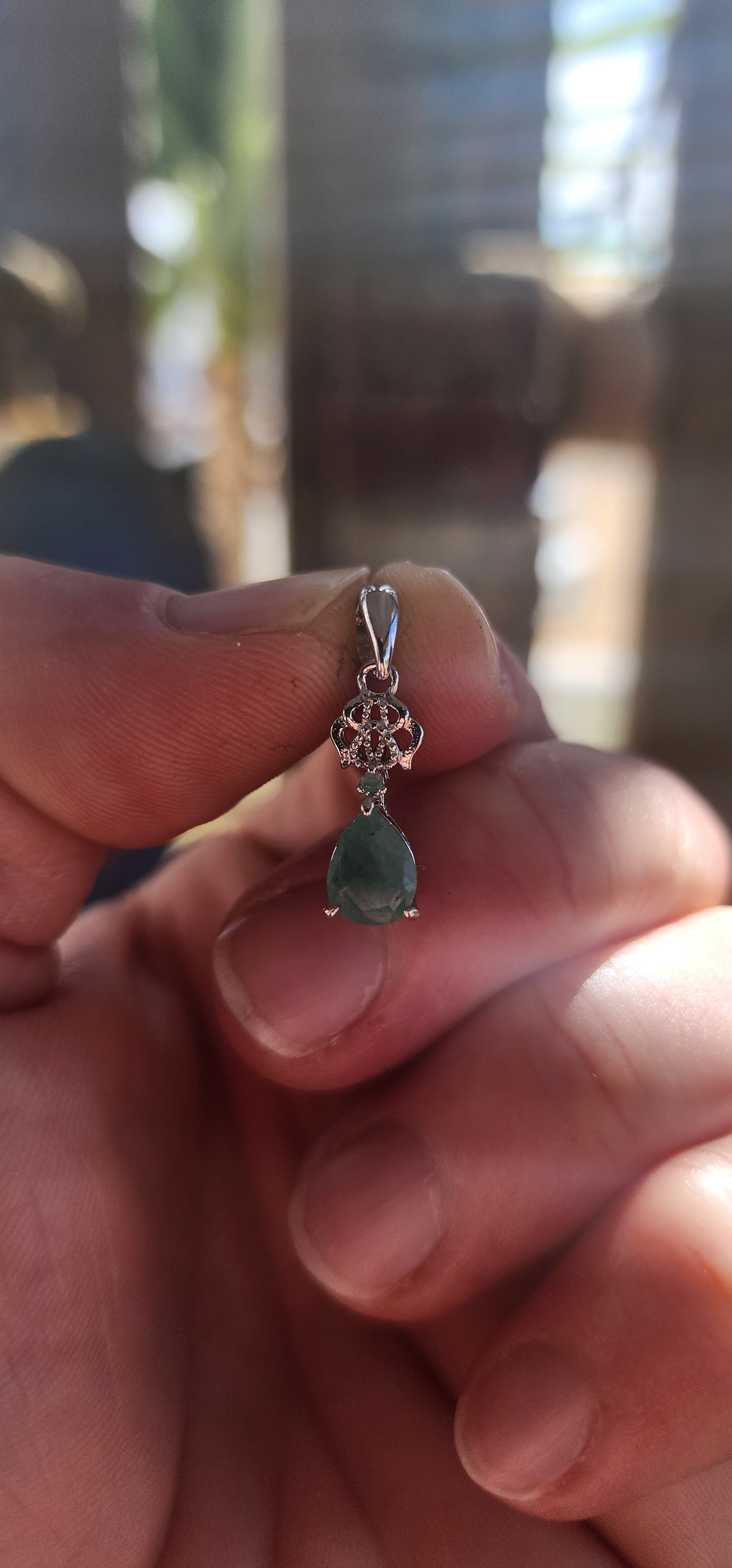 The Emerald Pendant – A Petite Heirloom of Sterling Silver.