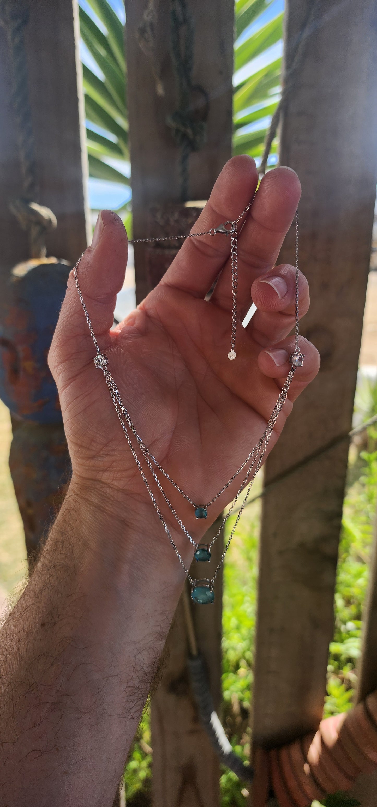 Unusually beautiful, feminine, and effortlessly chic!
This sterling silver layered three-strand necklace captures the magic of pure, crystal-blue radiance.
