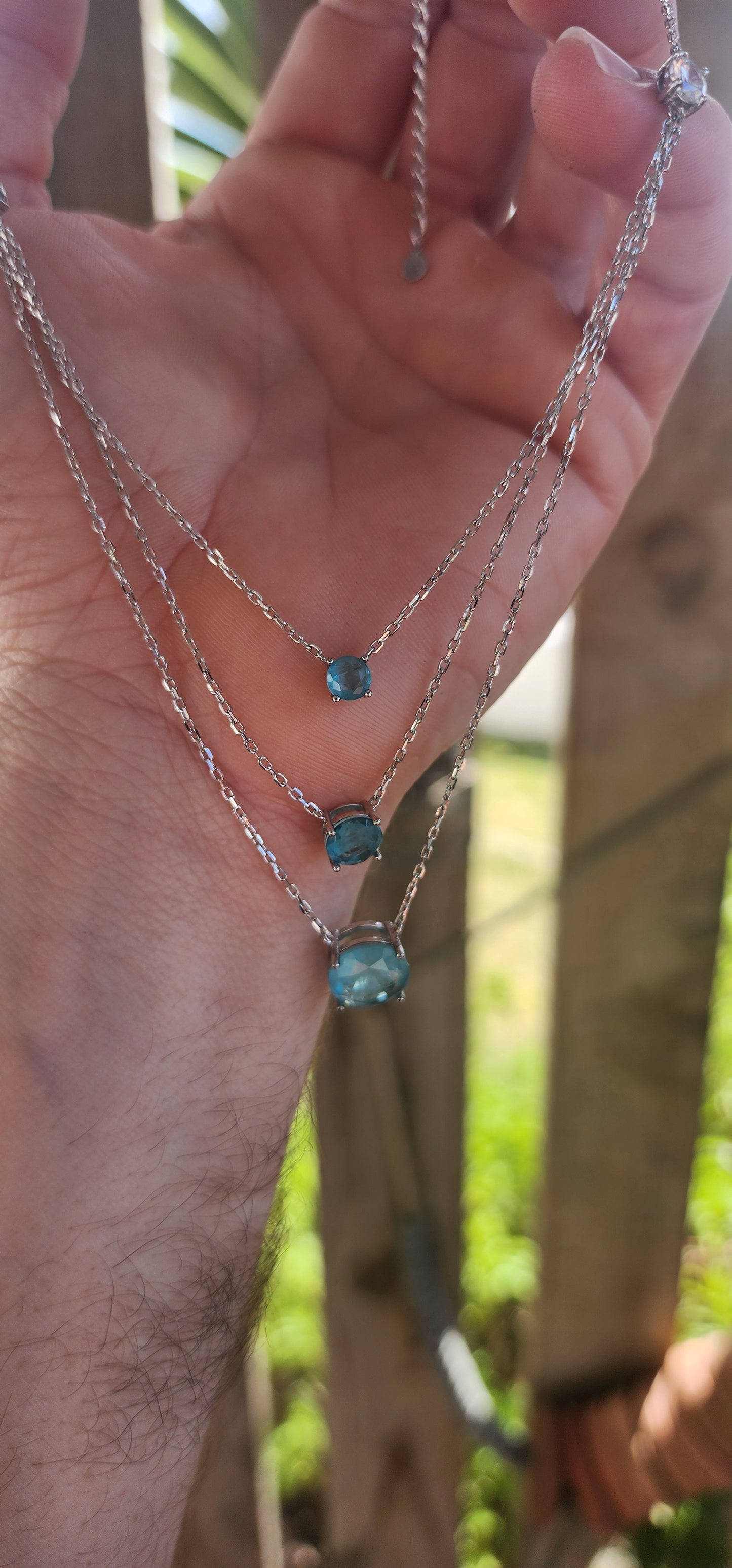 Unusually beautiful, feminine, and effortlessly chic!
This sterling silver layered three-strand necklace captures the magic of pure, crystal-blue radiance.
