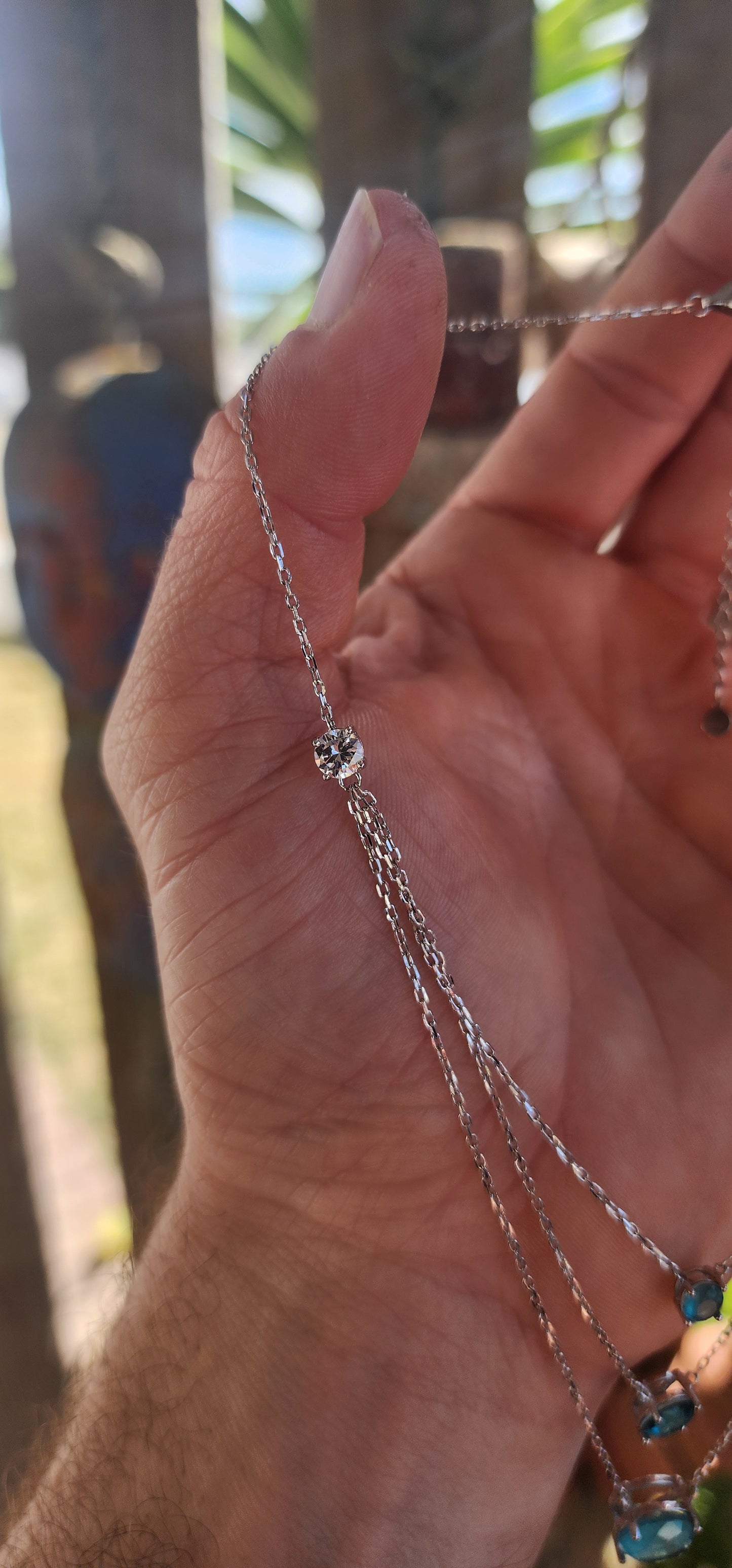 Unusually beautiful, feminine, and effortlessly chic!
This sterling silver layered three-strand necklace captures the magic of pure, crystal-blue radiance.