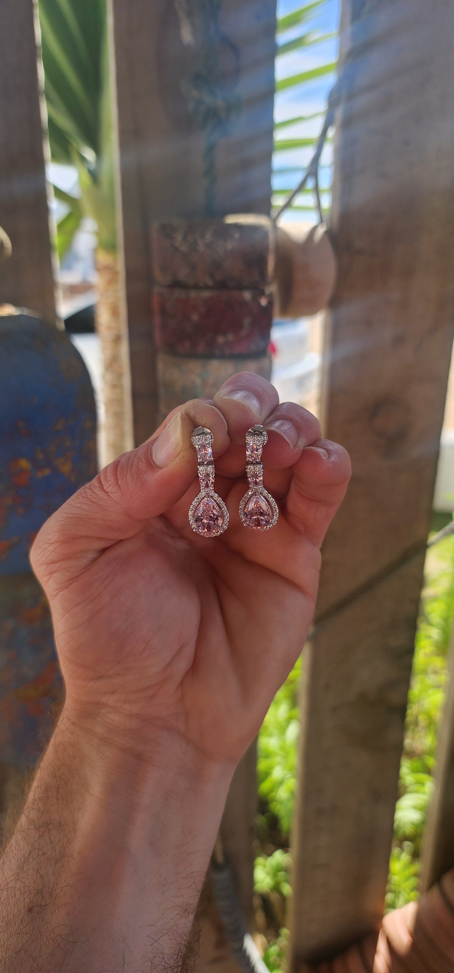 Crafted in solid sterling silver, these drop earrings are a dazzling celebration of all things feminine, flirty, and fabulously glamorous.