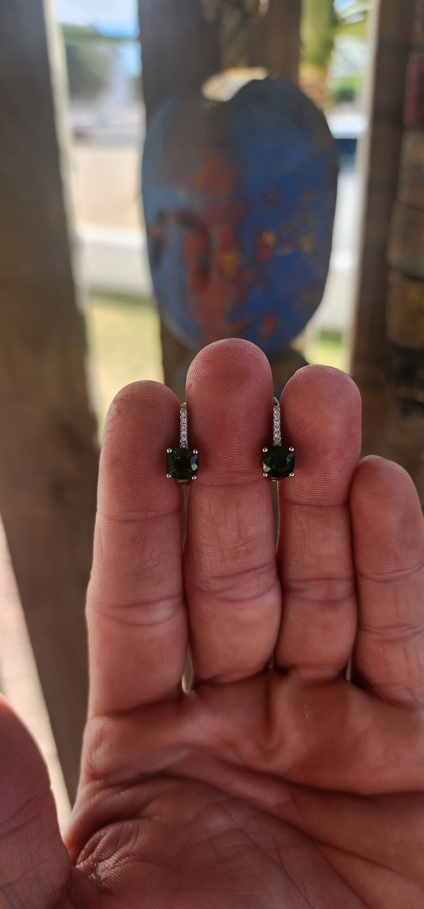 This exquisite pair of sterling silver Tsavorite earrings delivers a burst of rare, electric colour with every turn of the head