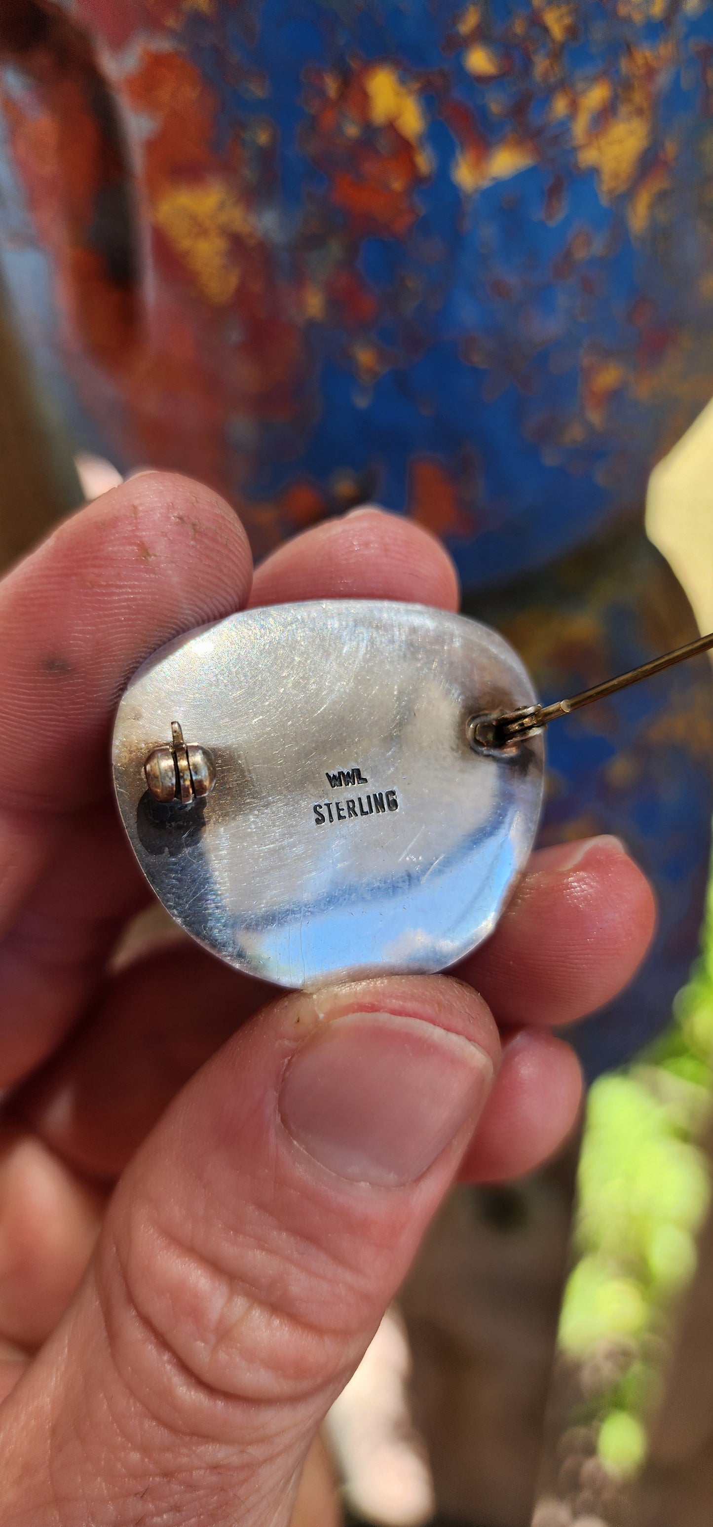 A bold and beautifully crafted vintage modernist brooch dating to the circa 1970s, this striking piece showcases a generously sized, high-domed Tiger’s Eye cabochon set in hand-crafted sterling silver.