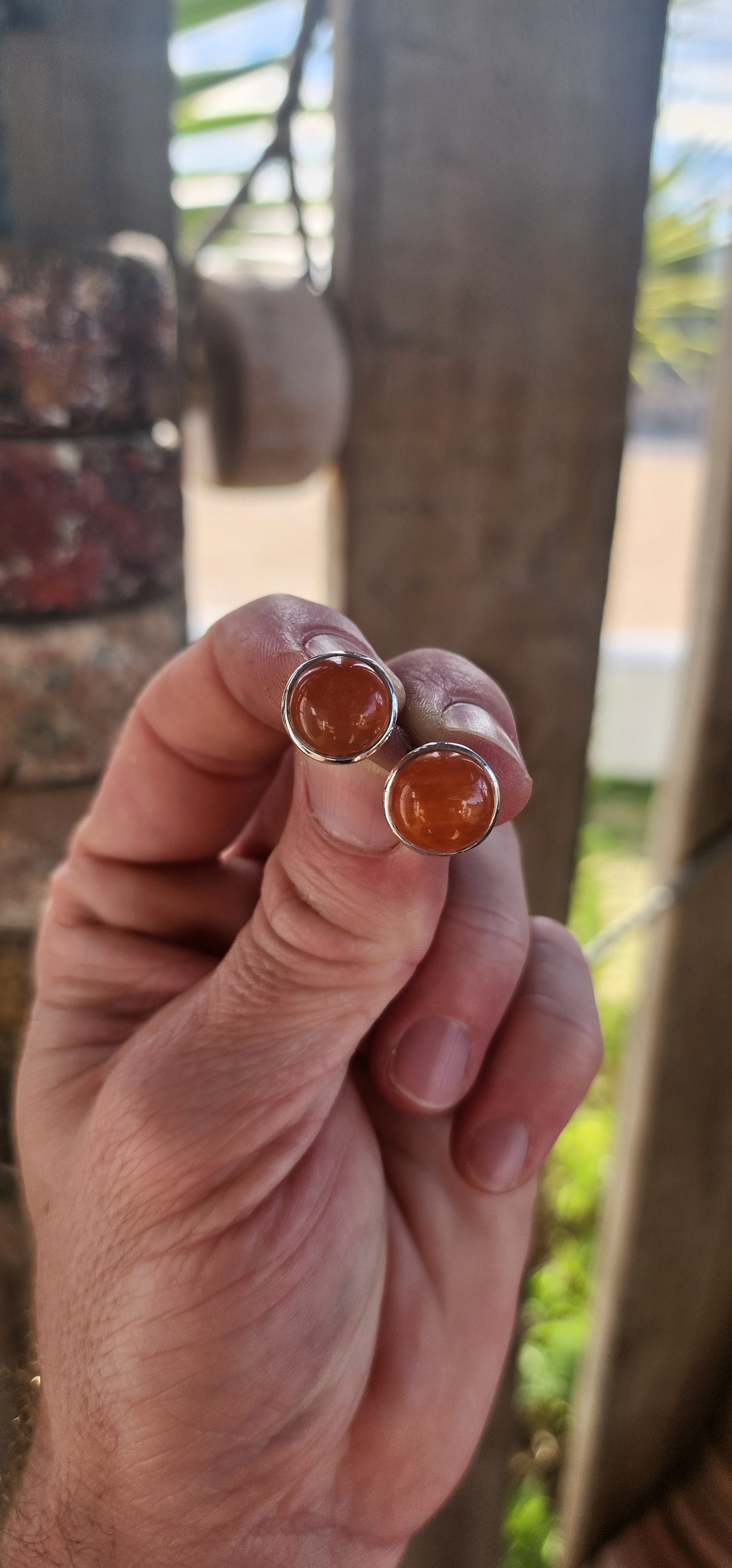 These marvelous sterling silver stud earrings deliver that effortless, earthy elegance that only natural gemstones can. Each earring features a warm, glowing round carnelian cabochon, tube-set in polished sterling silver for a clean, modern look.