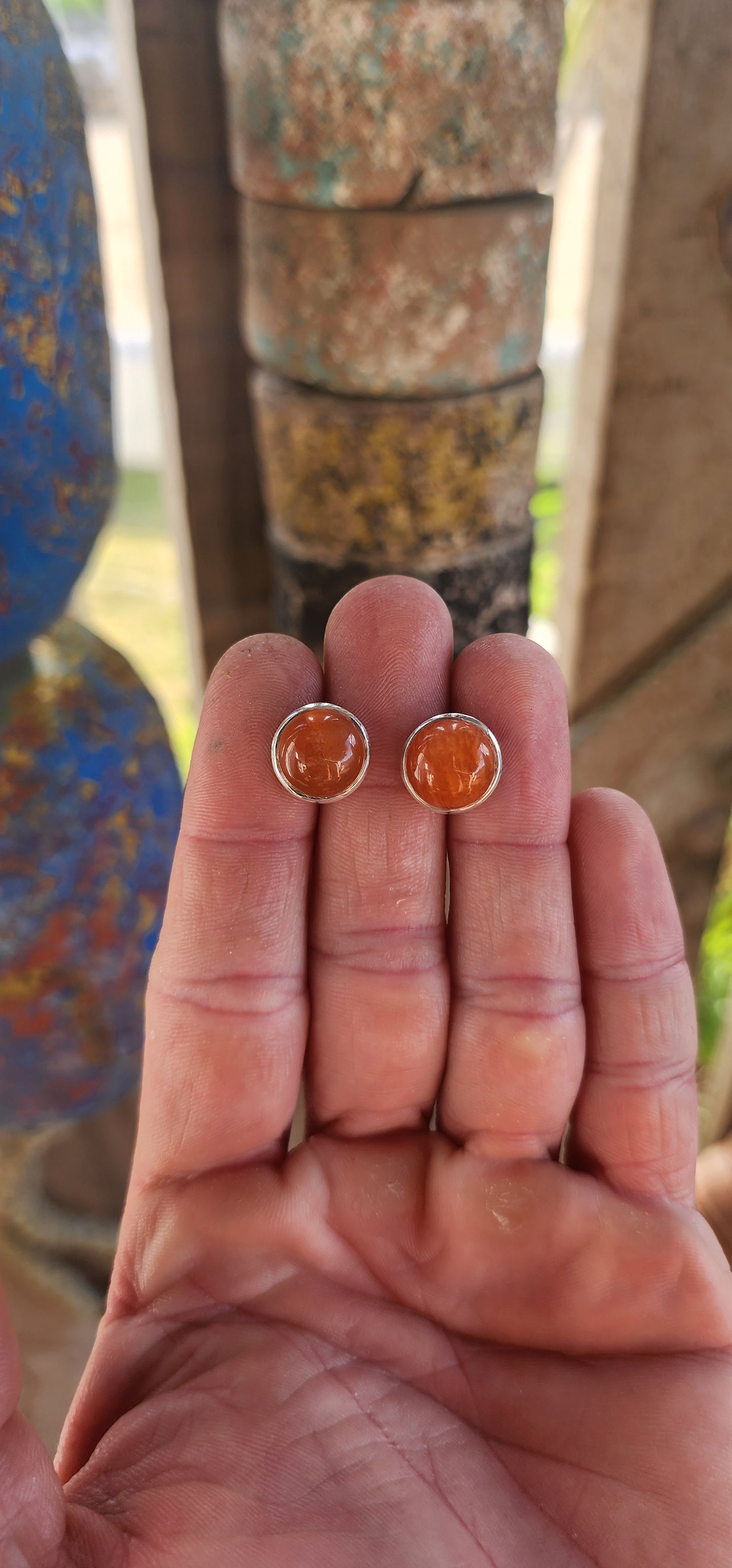 These marvelous sterling silver stud earrings deliver that effortless, earthy elegance that only natural gemstones can. Each earring features a warm, glowing round carnelian cabochon, tube-set in polished sterling silver for a clean, modern look.