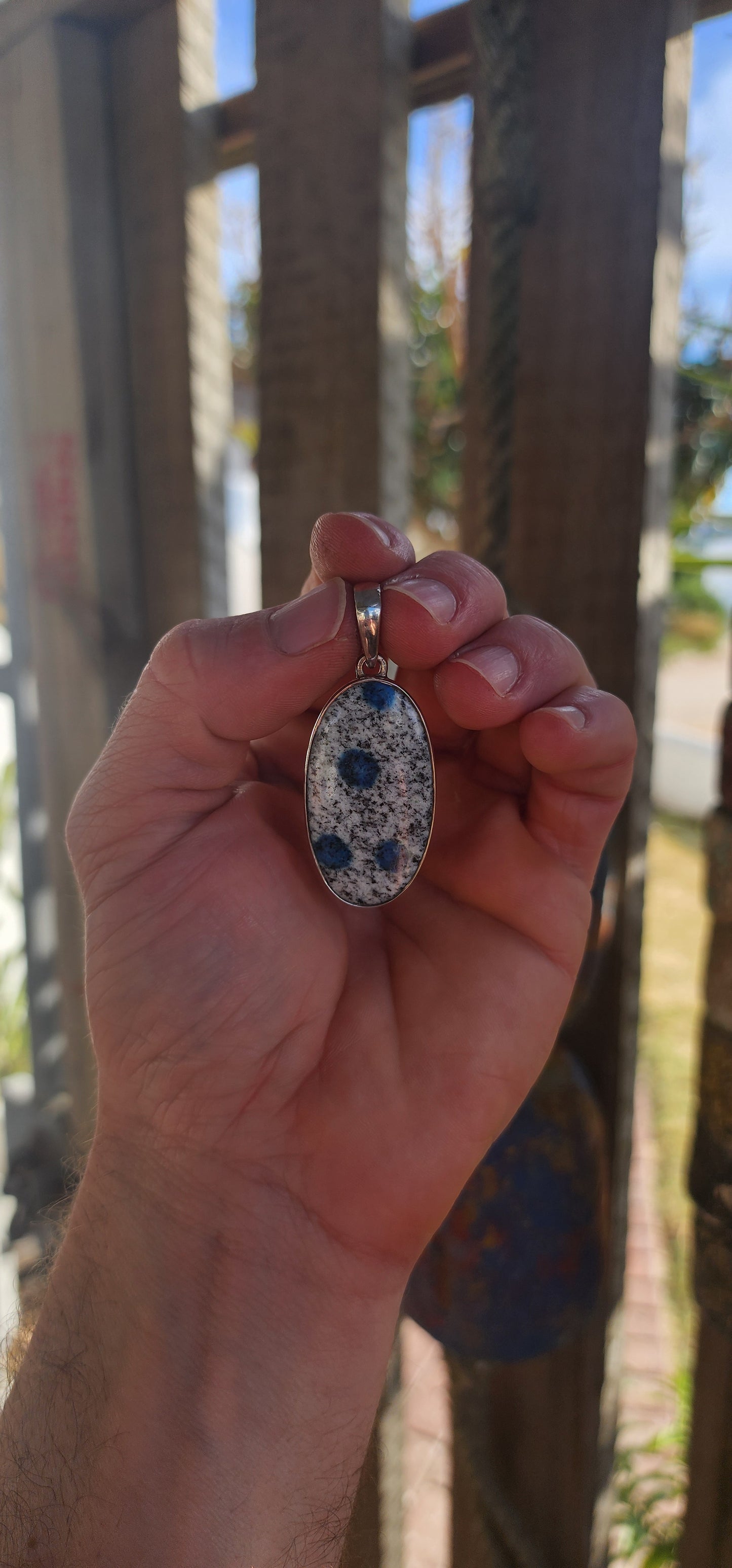 Beautiful sterling silver pendant featuring an oval-shaped rare K2 Jasper cabochon, securely tube-set in a sleek, modern silver frame.