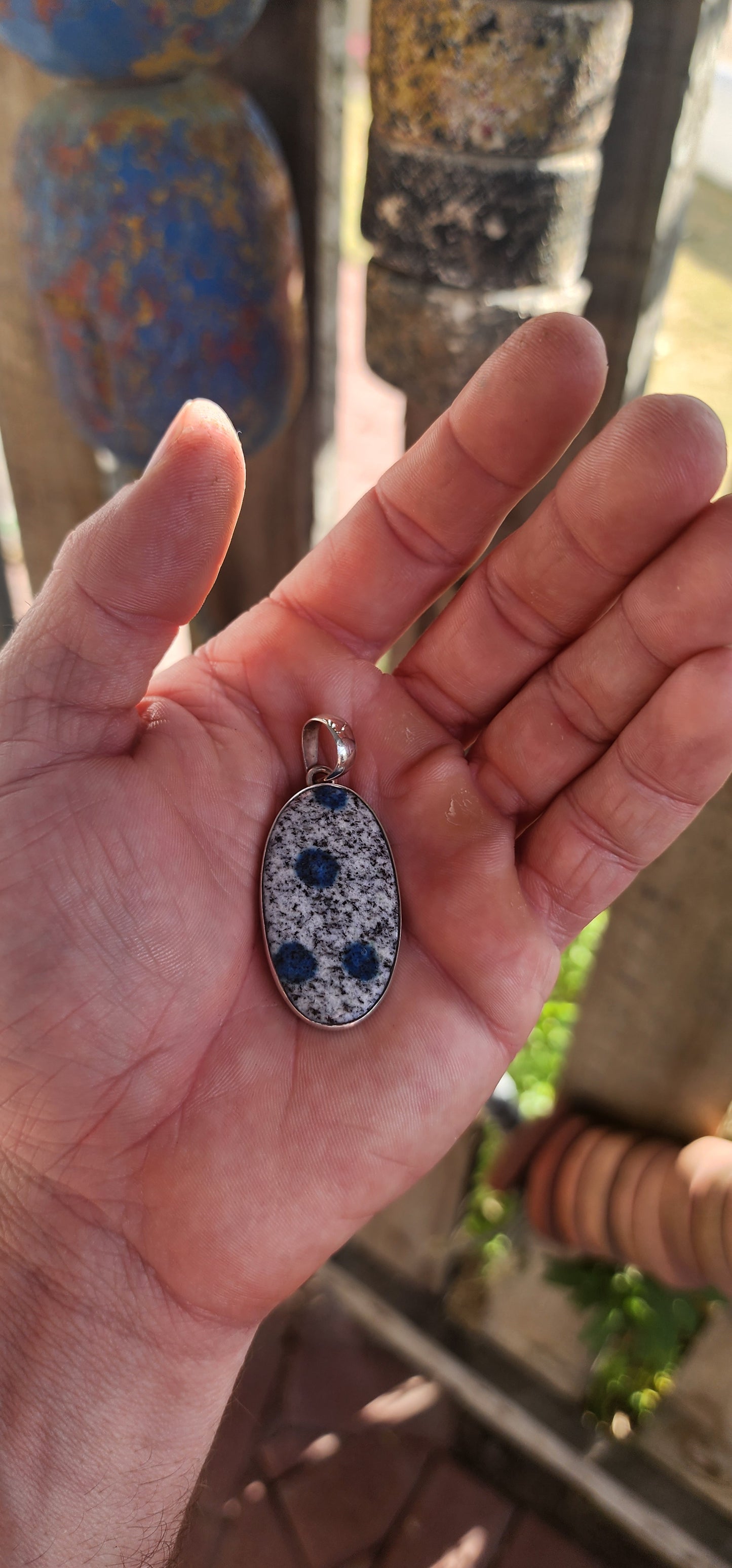 Beautiful sterling silver pendant featuring an oval-shaped rare K2 Jasper cabochon, securely tube-set in a sleek, modern silver frame.