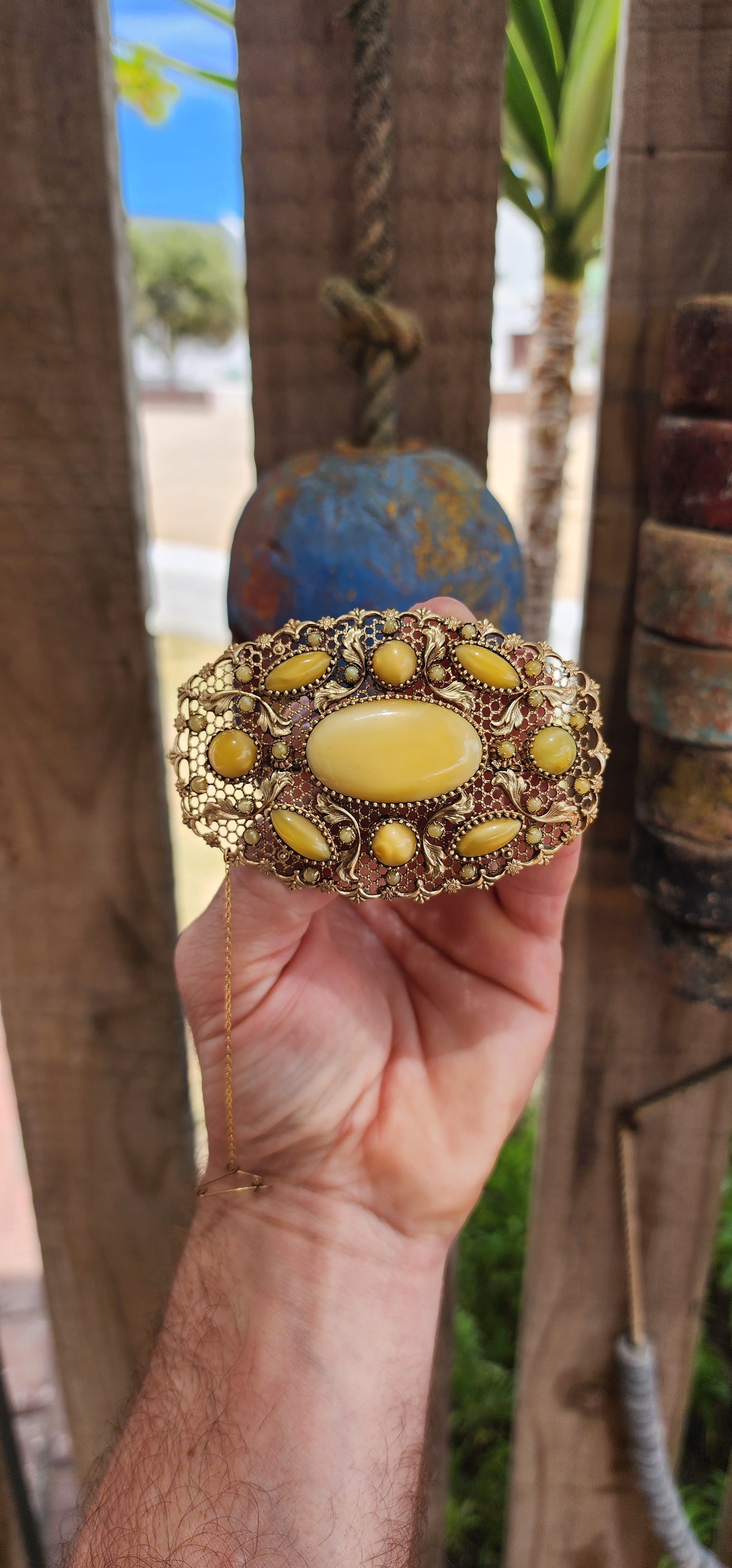 Prepare yourself, because this is not your average Czech brooch — this is a monumental 1920s Art Deco Czech masterpiece, an oversized, opulent explosion of filigree work and uranium satin glass.