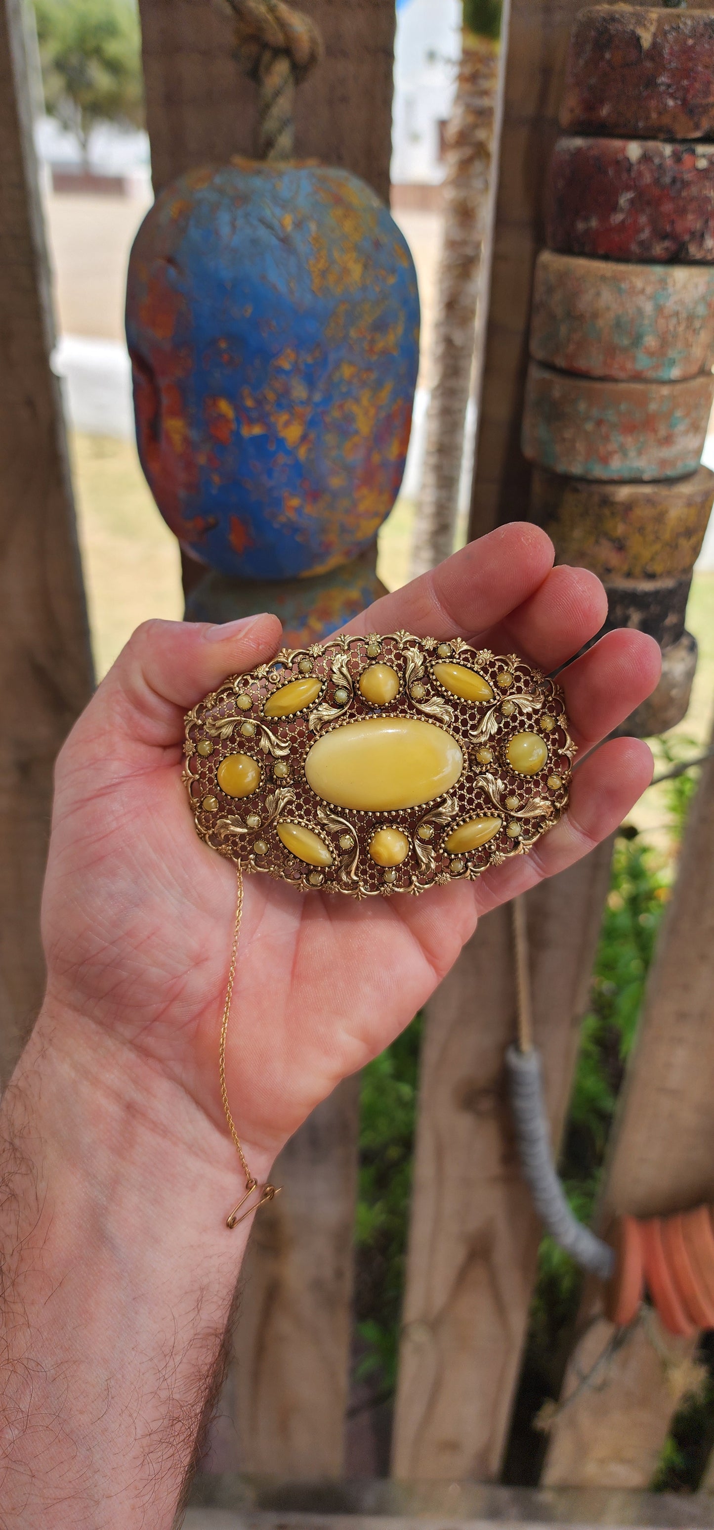 Prepare yourself, because this is not your average Czech brooch — this is a monumental 1920s Art Deco Czech masterpiece, an oversized, opulent explosion of filigree work and uranium satin glass.