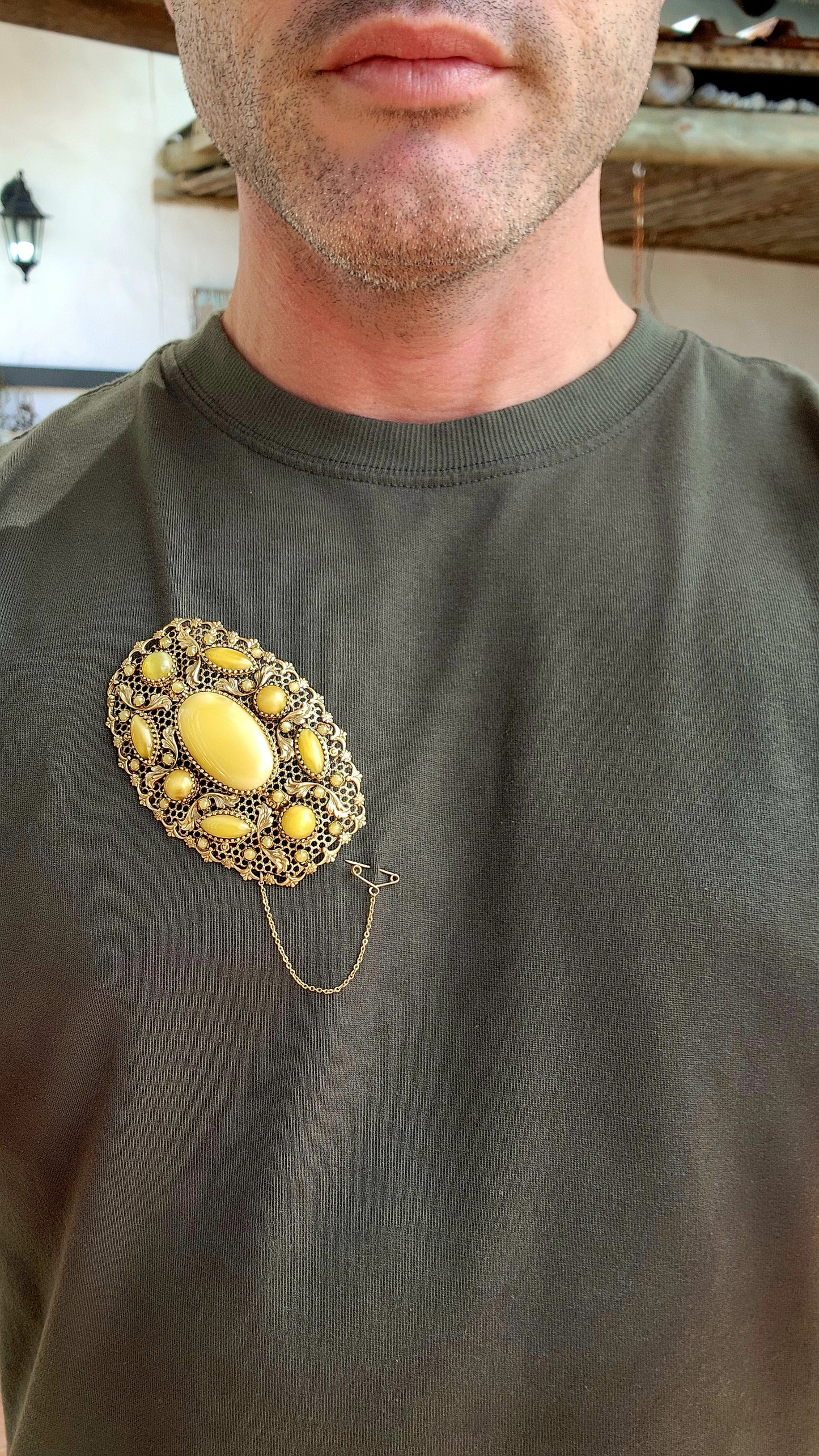 Prepare yourself, because this is not your average Czech brooch — this is a monumental 1920s Art Deco Czech masterpiece, an oversized, opulent explosion of filigree work and uranium satin glass.