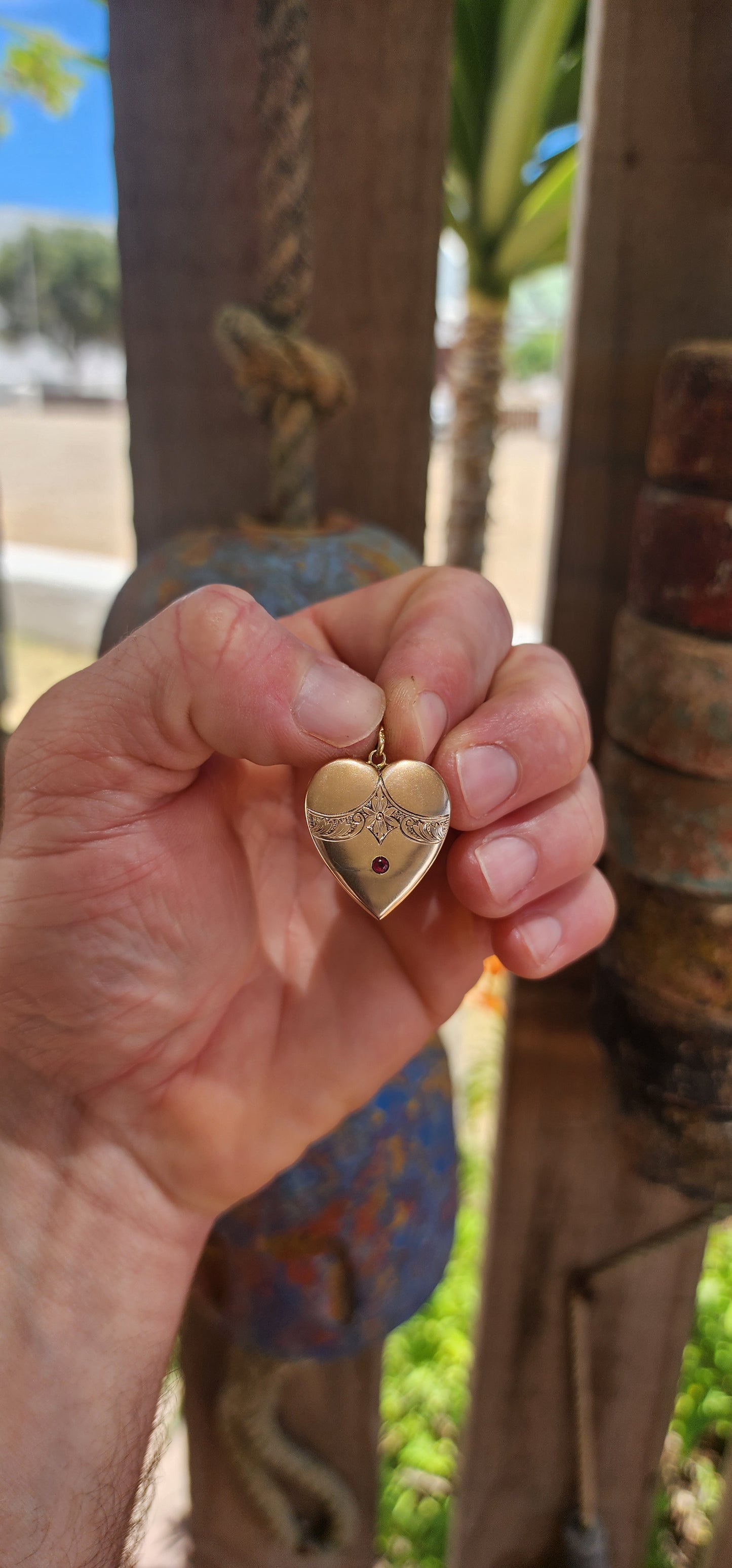 A truly breathtaking treasure from the romantic Edwardian era, this antique circa 1900 puffed heart pendant has survived more than 120 years with its beauty, grace, and symbolism entirely intact.