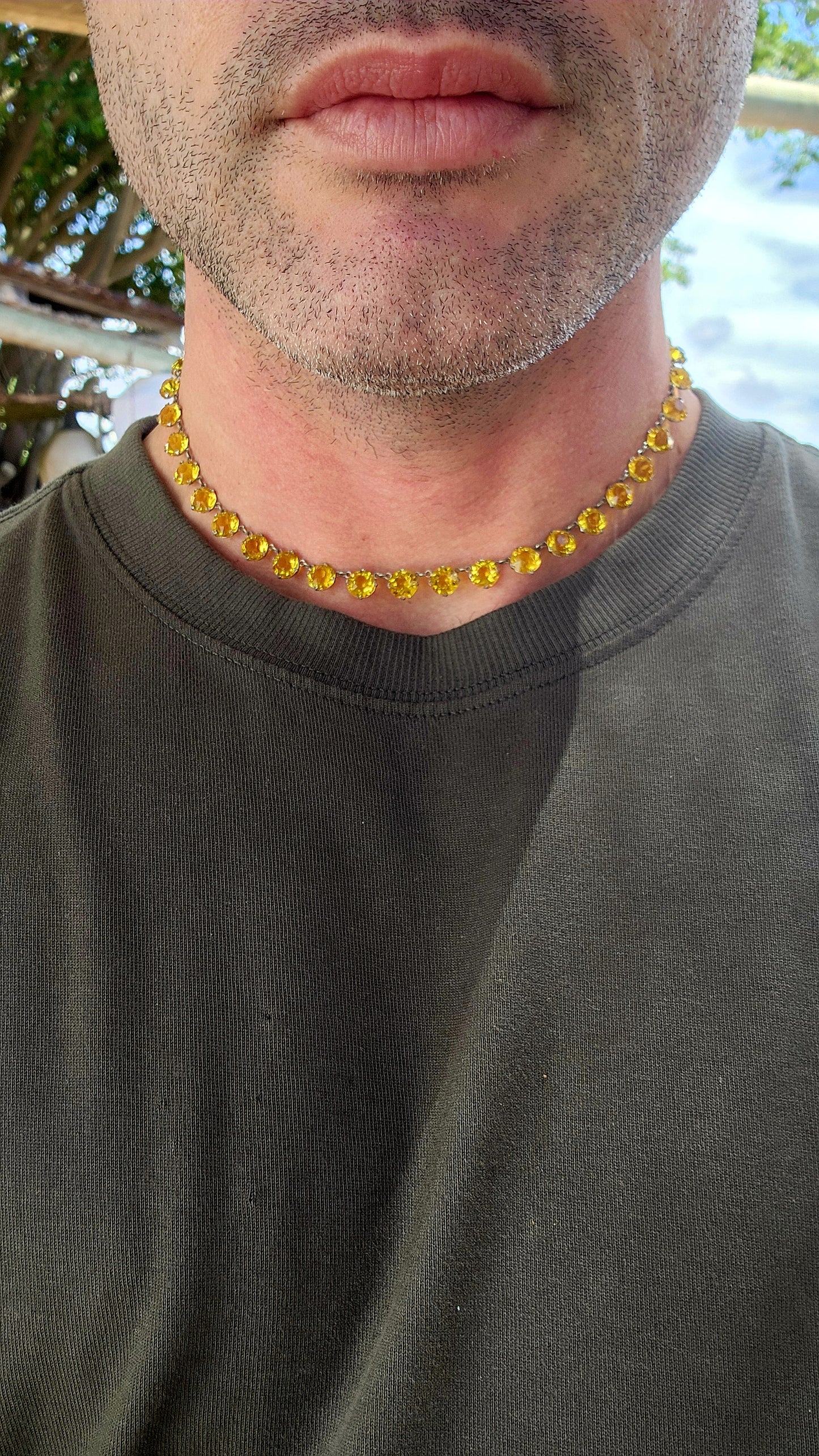 An absolutely spectacular and extremely sought-after Art Deco era circa 1930s sterling silver and yellow paste rivière necklace.