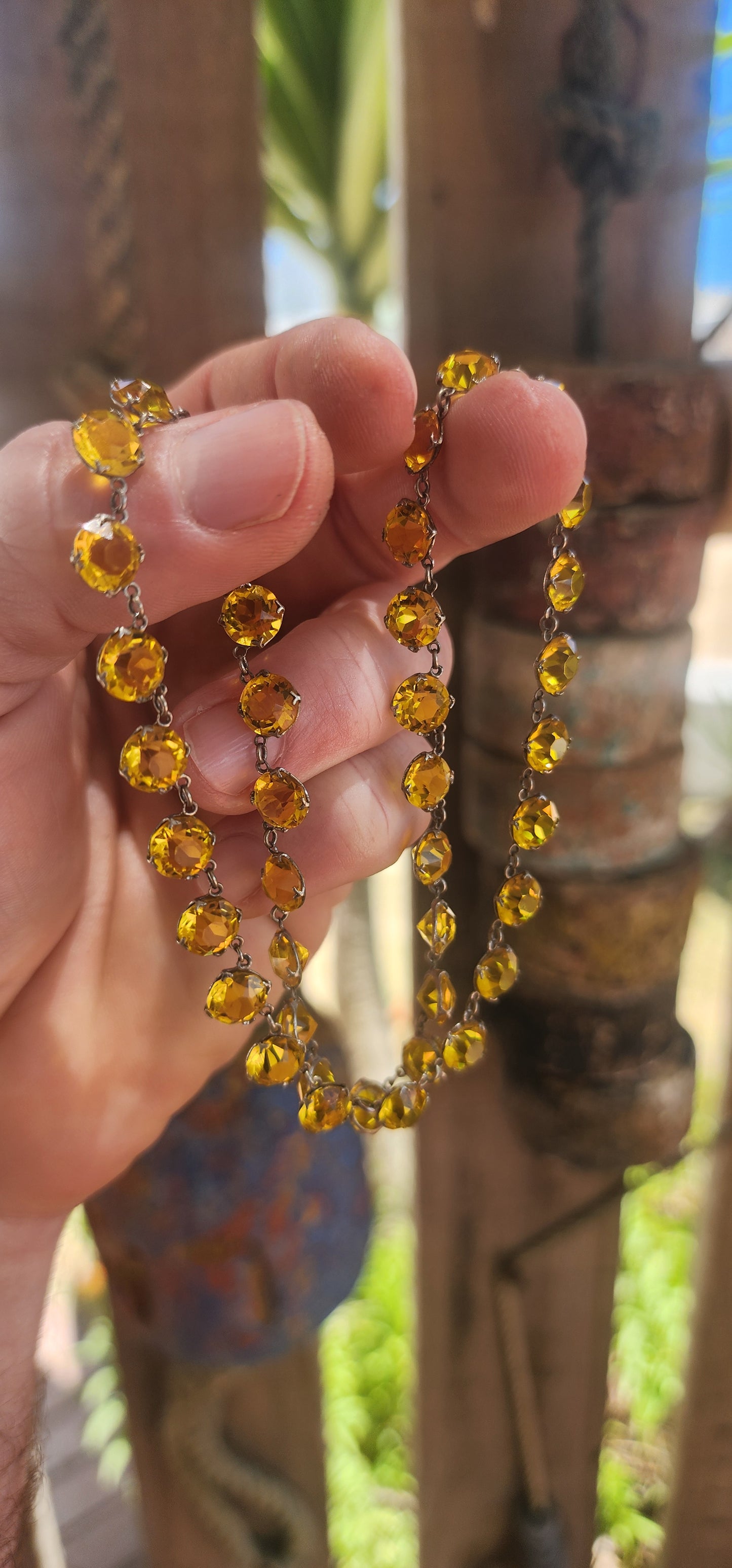 An absolutely spectacular and extremely sought-after Art Deco era circa 1930s sterling silver and yellow paste rivière necklace.