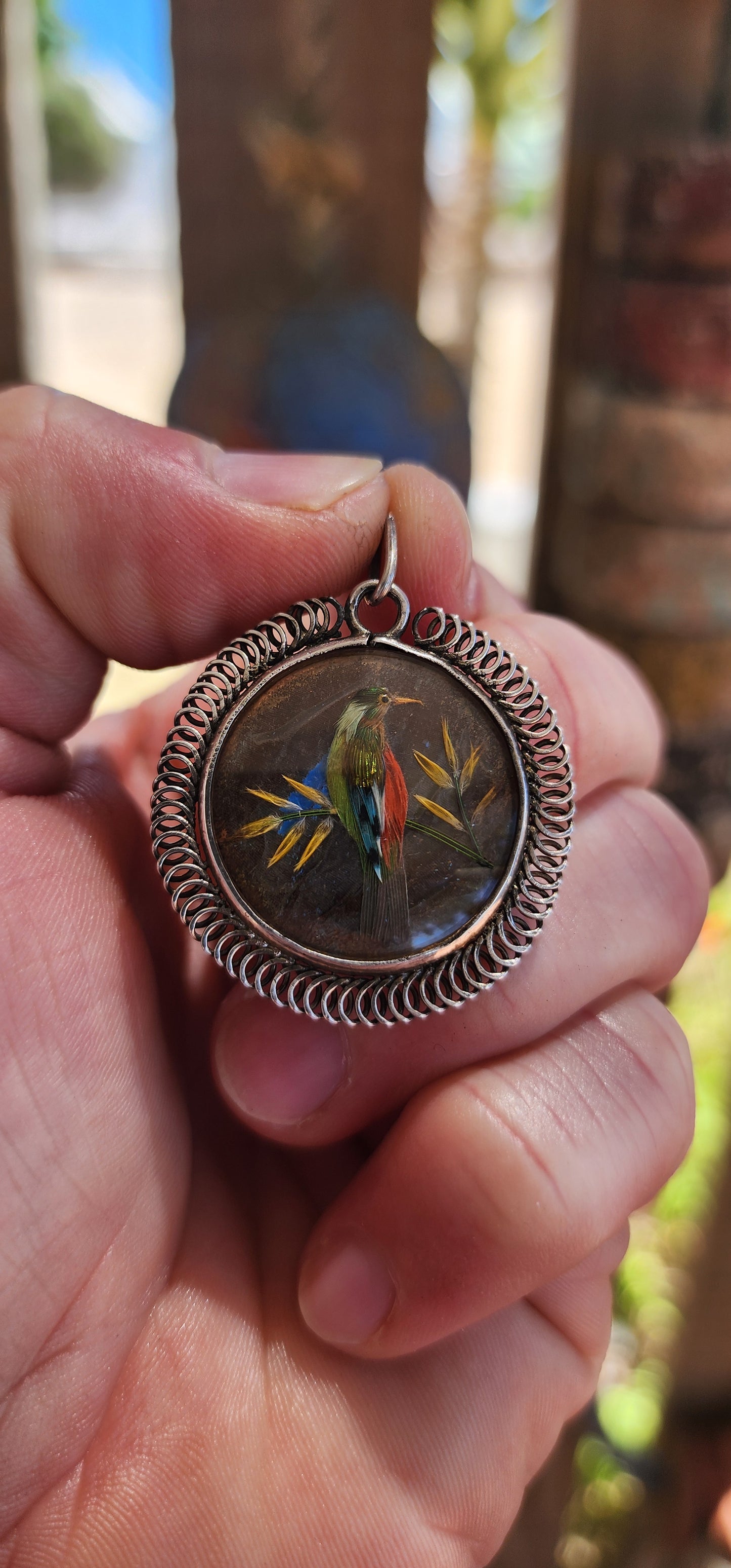 This extraordinary antique late Victorian–era double-sided sterling silver locket pendant is nothing short of a miniature museum piece — a breathtaking fusion of natural history, fine craftsmanship, and romantic 19th-century artistry.