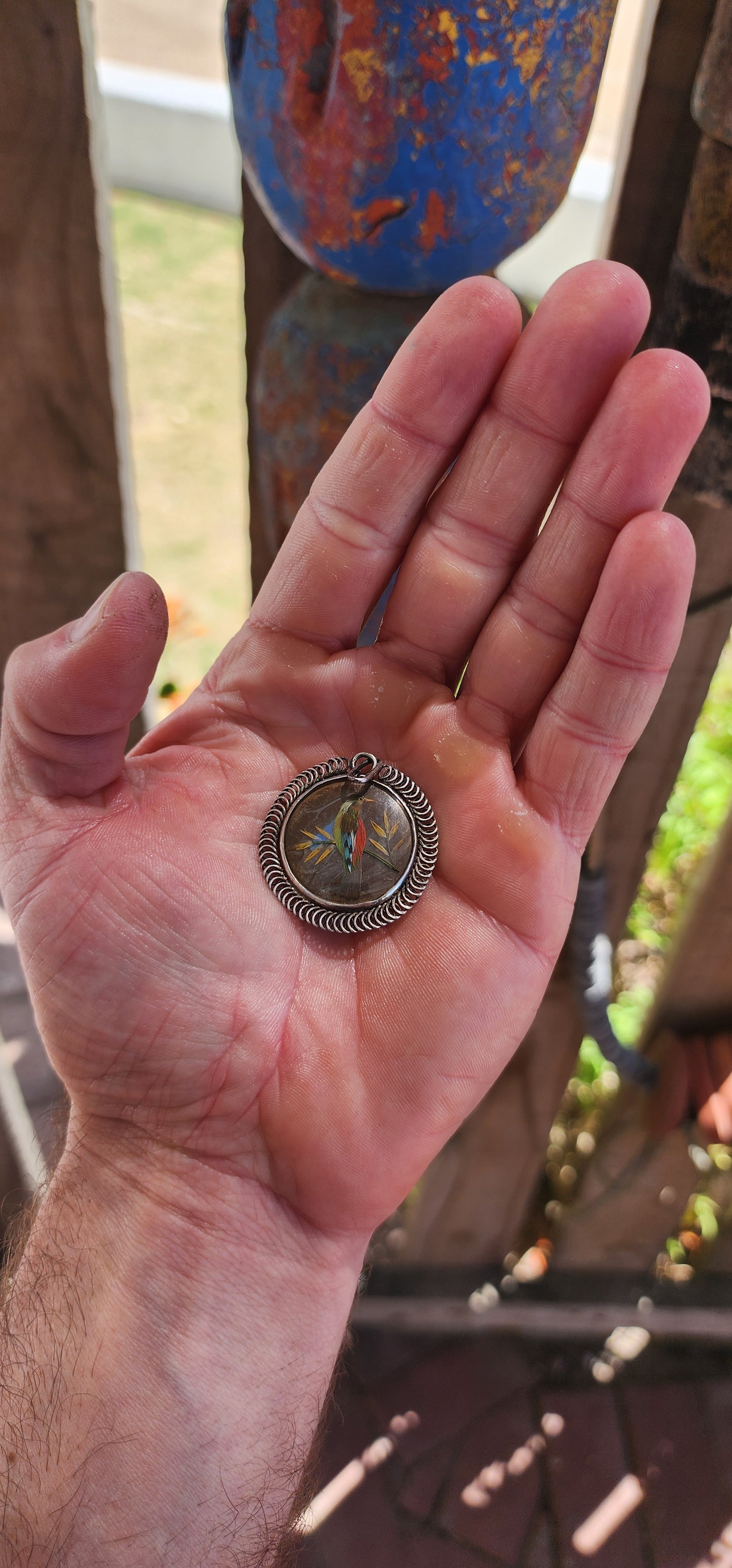 This extraordinary antique late Victorian–era double-sided sterling silver locket pendant is nothing short of a miniature museum piece — a breathtaking fusion of natural history, fine craftsmanship, and romantic 19th-century artistry.