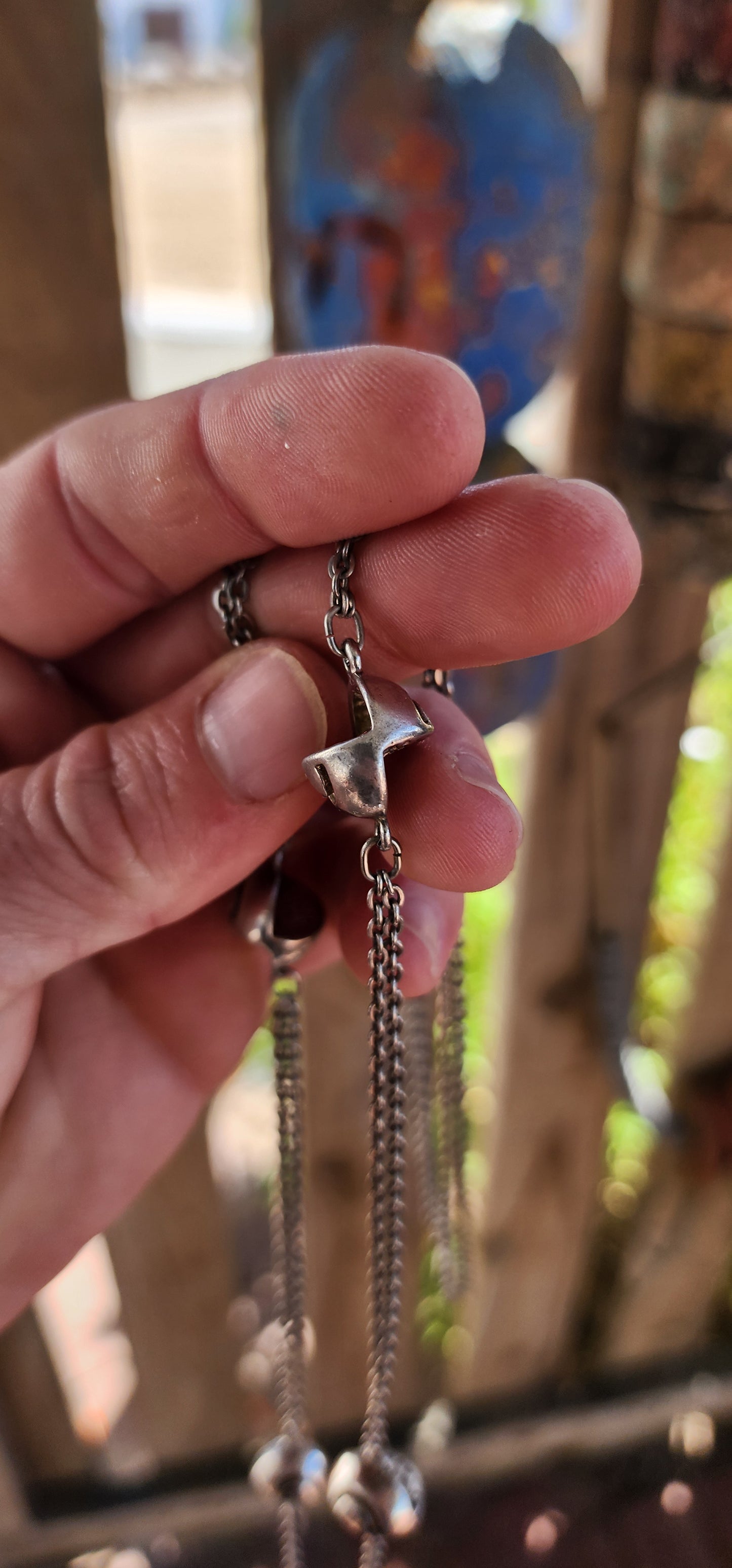 Up for grabs is an artisan-made, extra-length sterling silver modernist necklace that feels like it’s travelled straight through a wormhole from a futuristic design studio somewhere between 1960s Space Age optimism and outer-galactic couture.