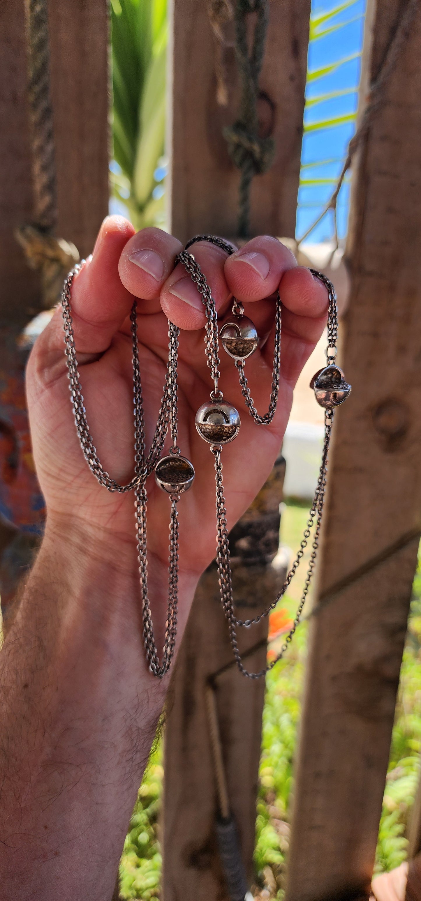 Up for grabs is an artisan-made, extra-length sterling silver modernist necklace that feels like it’s travelled straight through a wormhole from a futuristic design studio somewhere between 1960s Space Age optimism and outer-galactic couture.