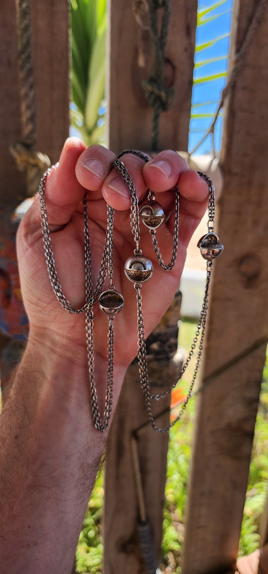 Up for grabs is an artisan-made, extra-length sterling silver modernist necklace that feels like it’s travelled straight through a wormhole from a futuristic design studio somewhere between 1960s Space Age optimism and outer-galactic couture.