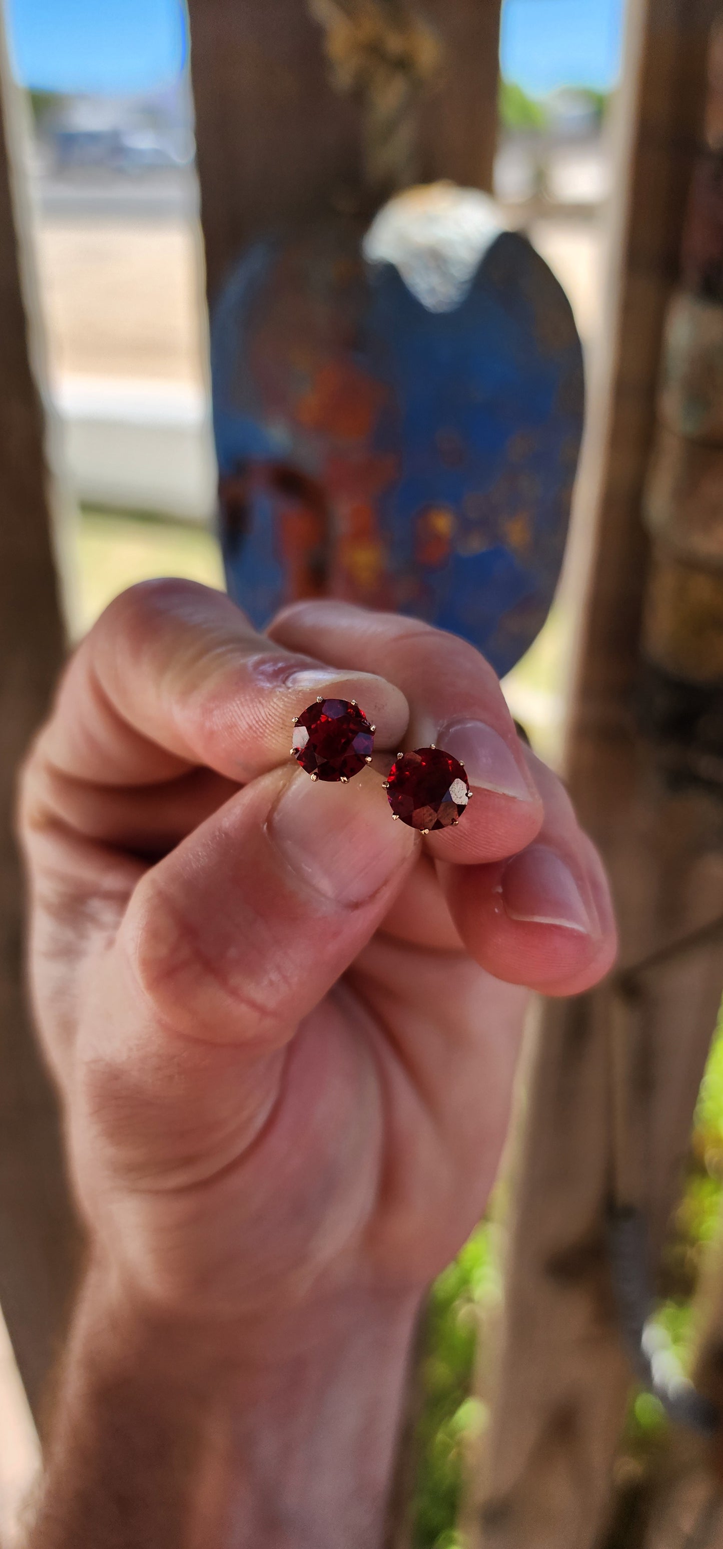 These are an exceptional and increasingly scarce pair of authentic Victorian-era stud earrings, dating to the mid–late 19th century, crafted in 9ct rose gold and set with vivid cranberry-red paste rhinestones of remarkable colour and life.