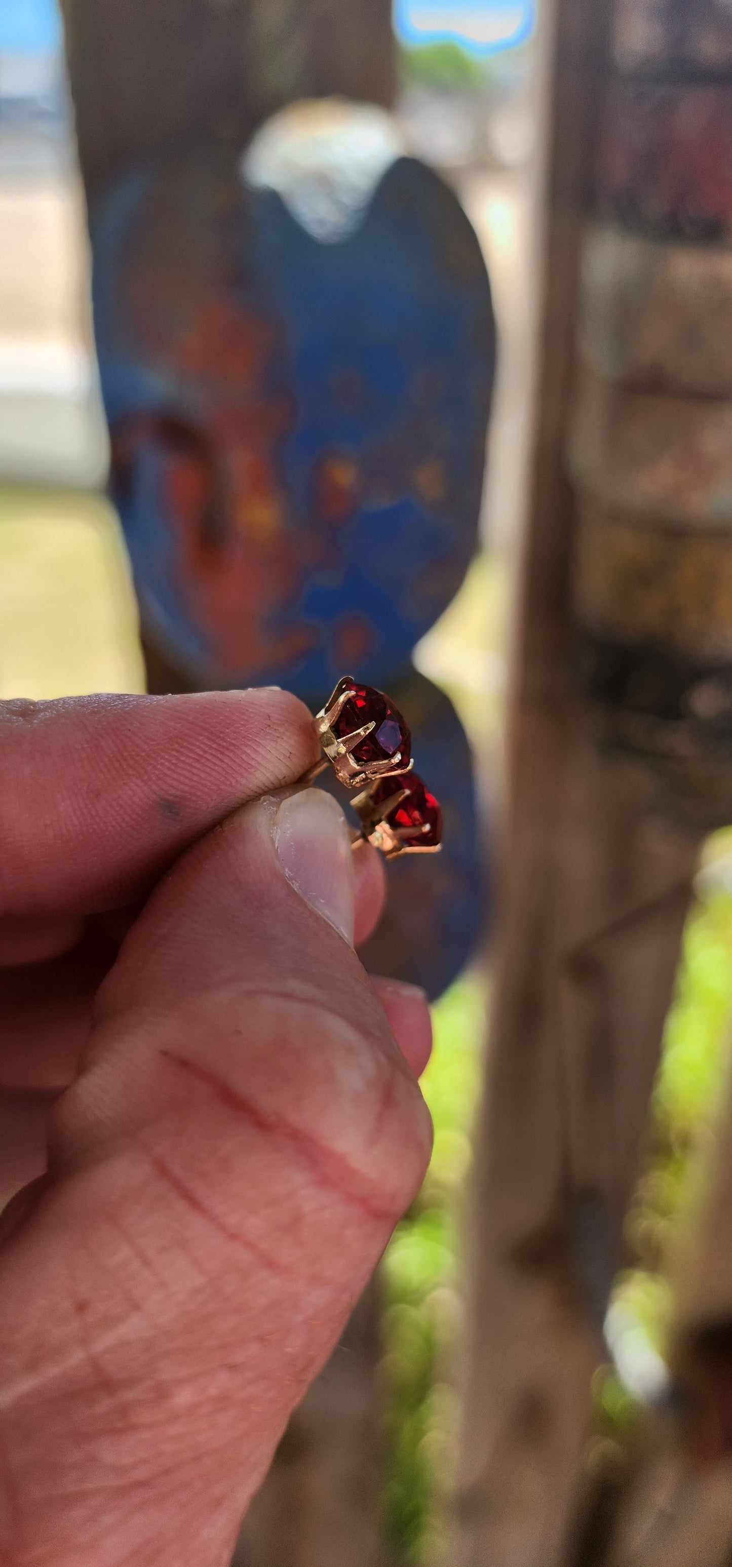 These are an exceptional and increasingly scarce pair of authentic Victorian-era stud earrings, dating to the mid–late 19th century, crafted in 9ct rose gold and set with vivid cranberry-red paste rhinestones of remarkable colour and life.