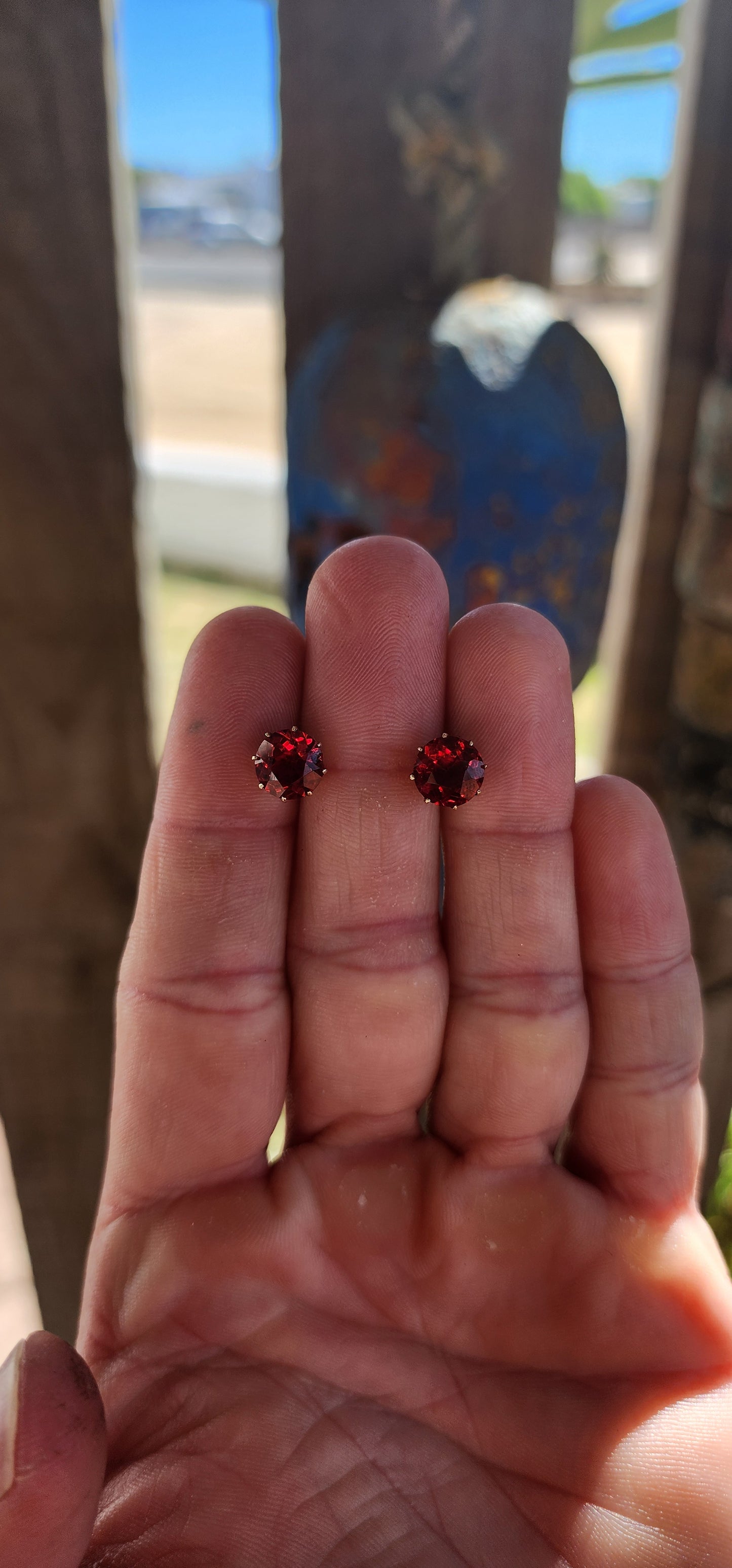 These are an exceptional and increasingly scarce pair of authentic Victorian-era stud earrings, dating to the mid–late 19th century, crafted in 9ct rose gold and set with vivid cranberry-red paste rhinestones of remarkable colour and life.