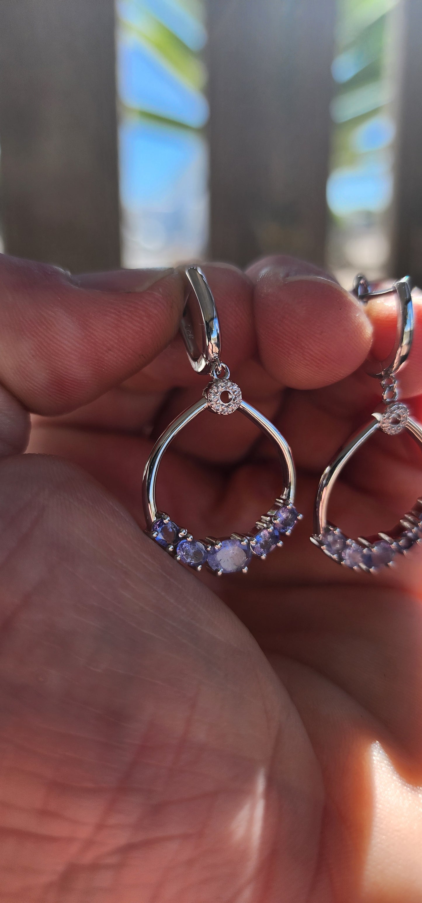 Classical, graceful, and quietly enchanting — these sterling silver dangle earrings are a beautiful celebration of Tanzanite’s magical colour play.