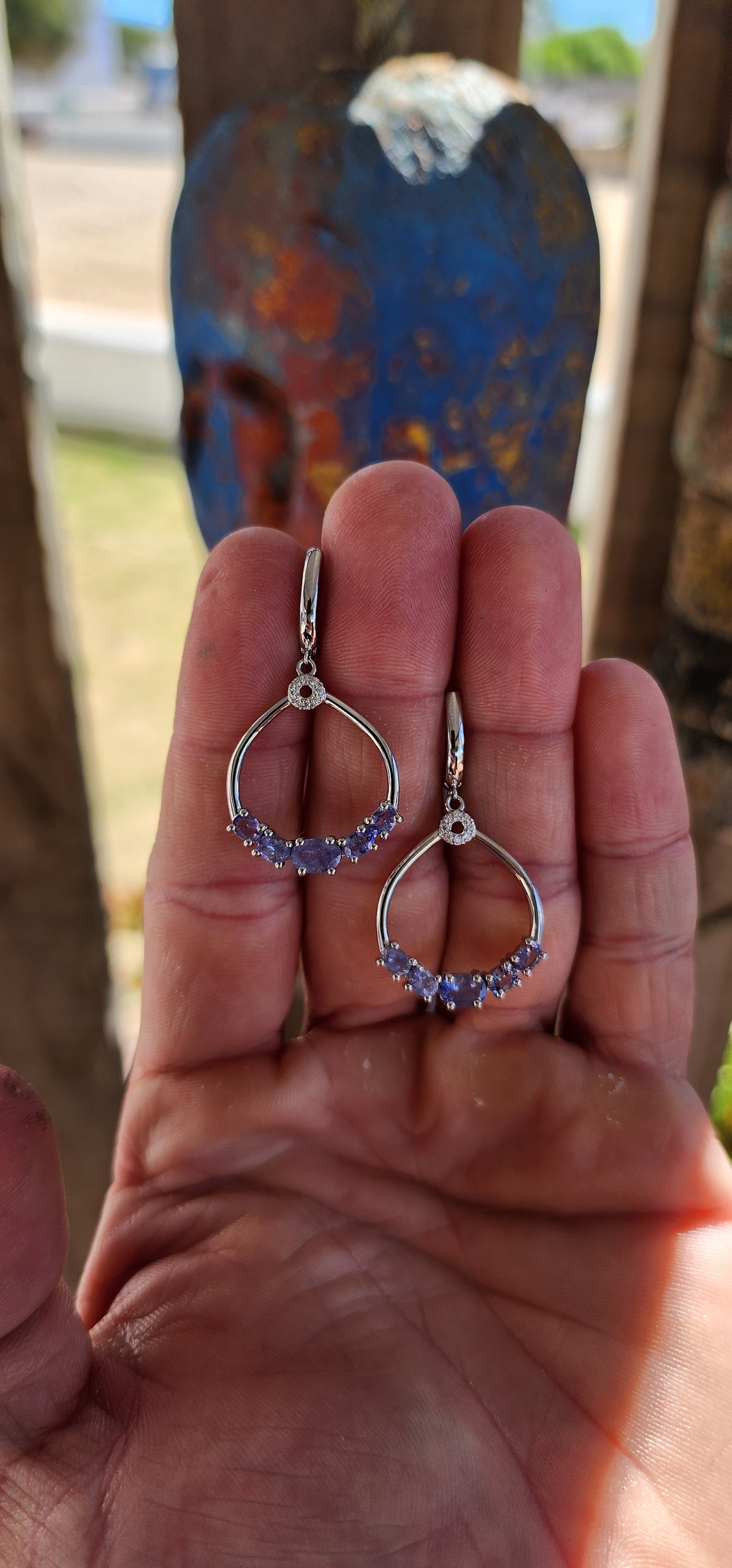 Classical, graceful, and quietly enchanting — these sterling silver dangle earrings are a beautiful celebration of Tanzanite’s magical colour play.