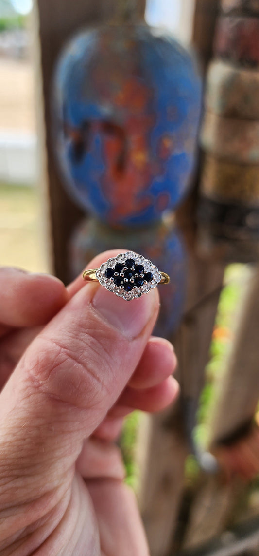 This exquisite bi-colour cluster ring is crafted in sterling silver with a luxurious 18ct yellow gold plated band, giving it an irresistible antique-inspired contrast.