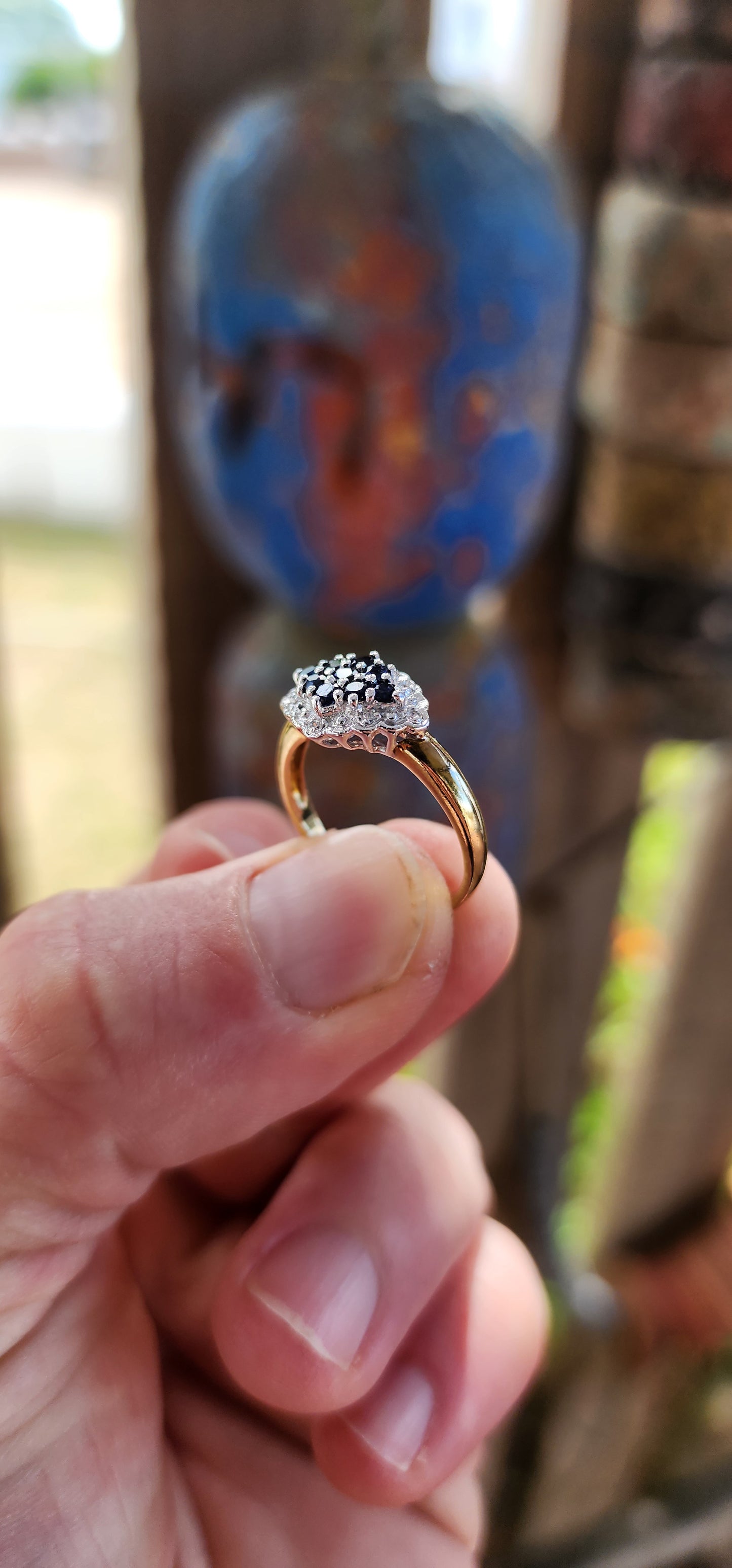 This exquisite bi-colour cluster ring is crafted in sterling silver with a luxurious 18ct yellow gold plated band, giving it an irresistible antique-inspired contrast.