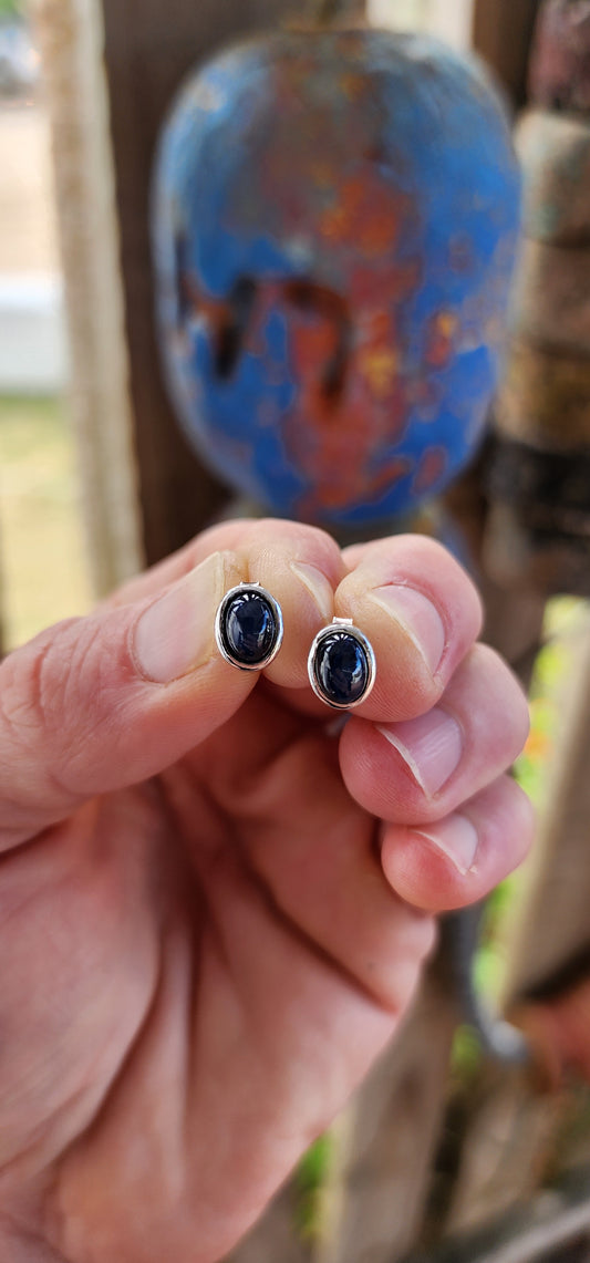 These sterling silver unisex stud earrings may be petite in scale, but they are absolutely cosmic in presence.