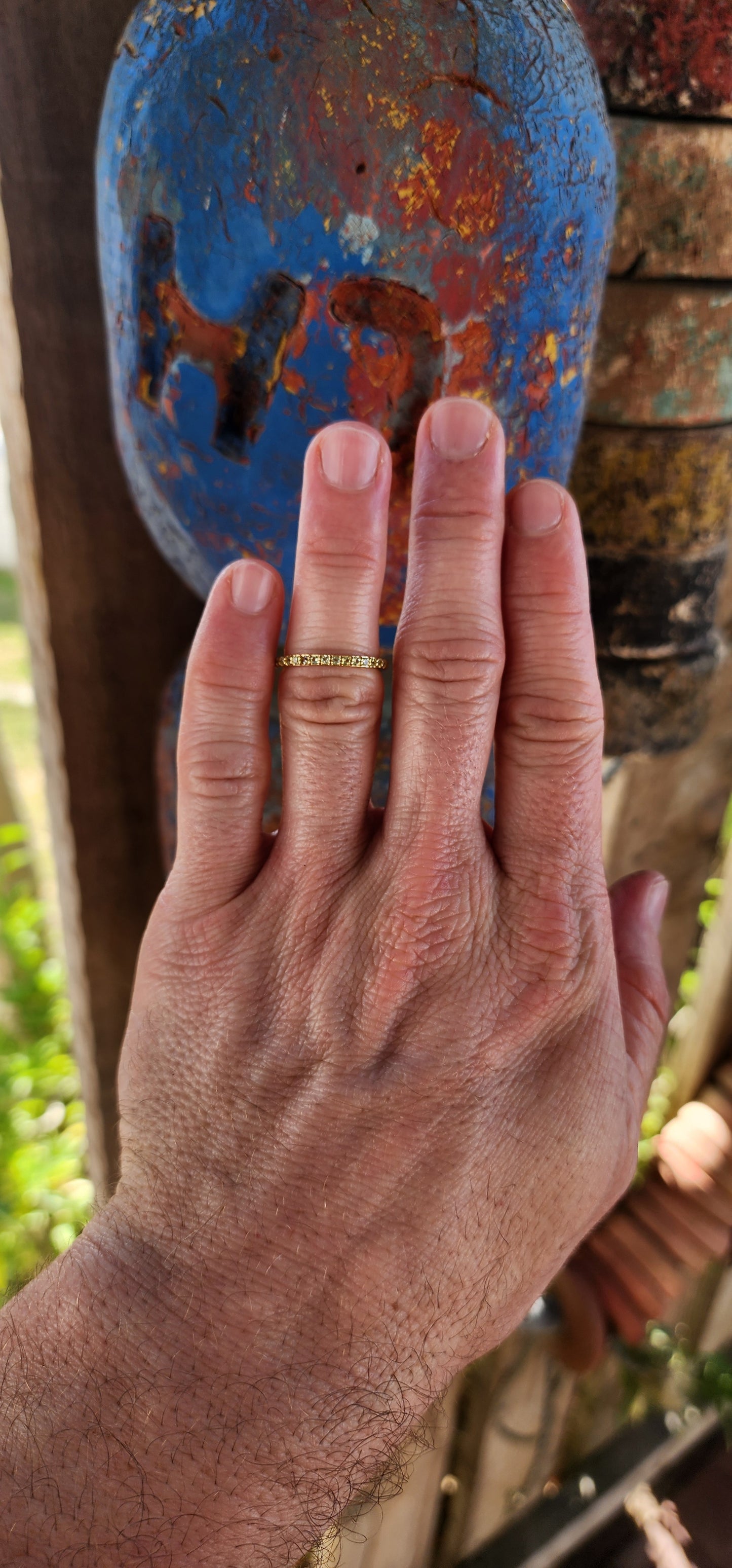 A sterling silver full eternity stacking ring, luxuriously plated in 18ct yellow gold and adorned with a continuous circle of sparkling Green Peridots.