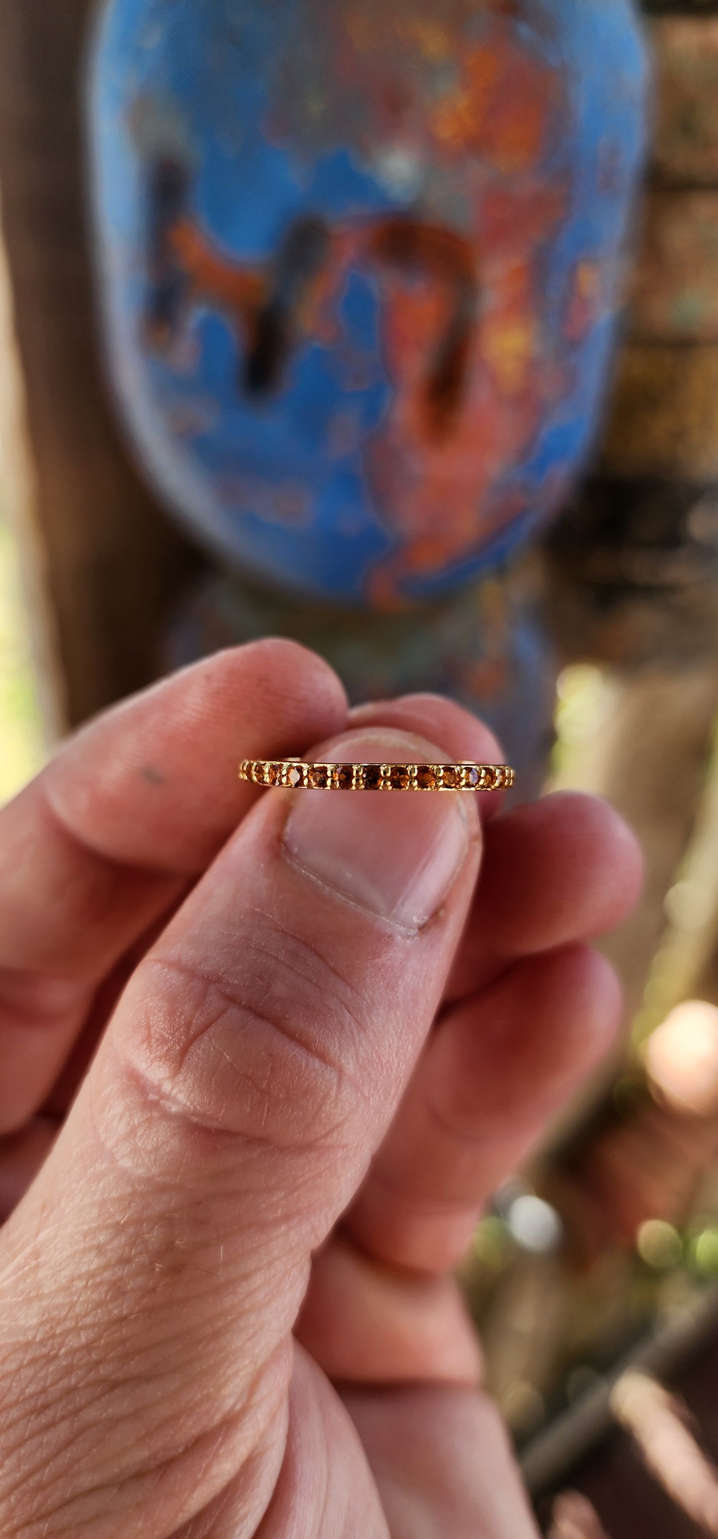 A sterling silver full eternity stacking ring, luxuriously plated in 18ct yellow gold and adorned with a continuous circle of sparkling Orange Madeira Citrine's.