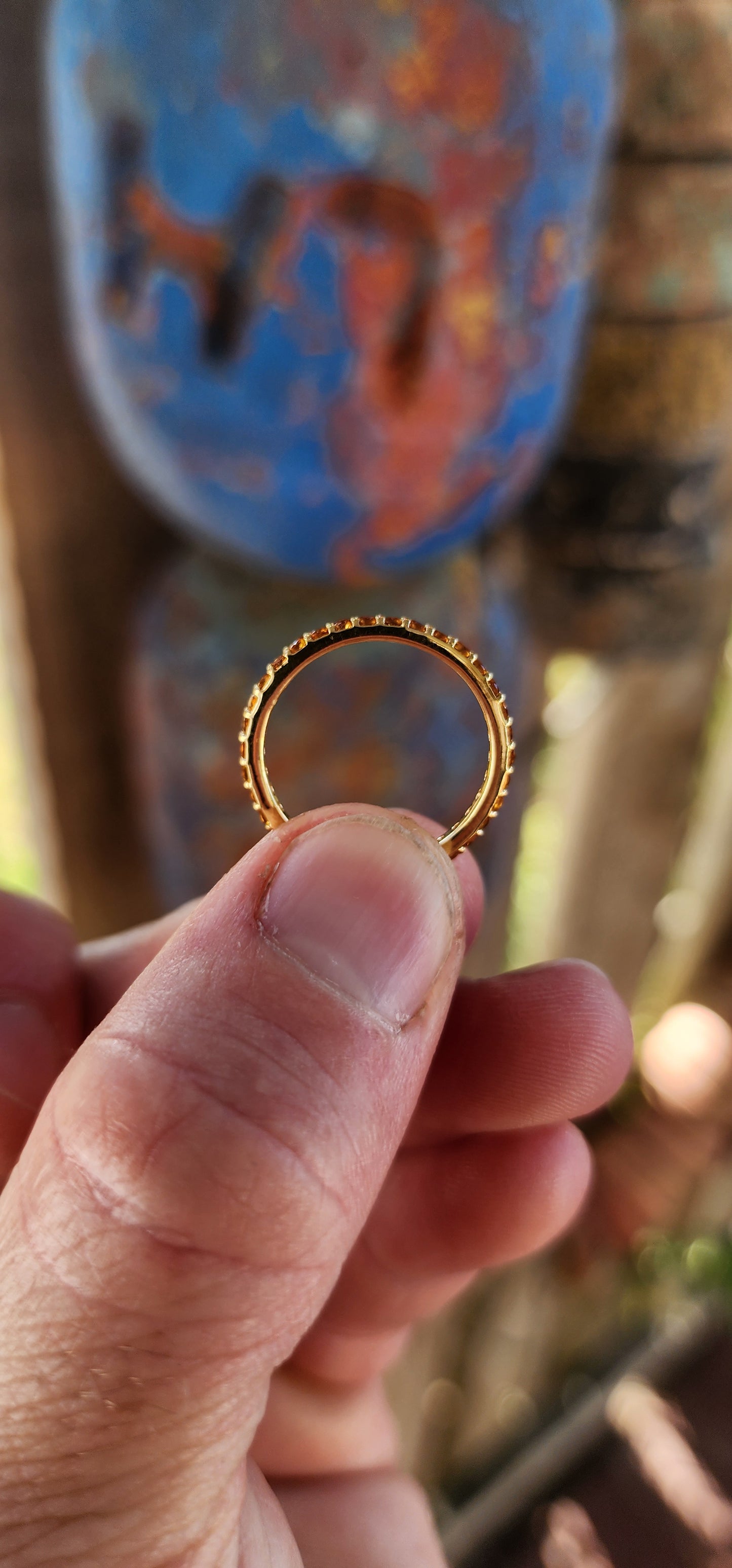 A sterling silver full eternity stacking ring, luxuriously plated in 18ct yellow gold and adorned with a continuous circle of sparkling Orange Madeira Citrine's.