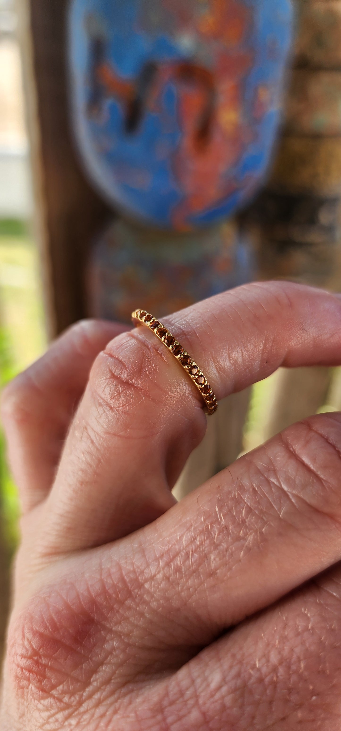 A sterling silver full eternity stacking ring, luxuriously plated in 18ct yellow gold and adorned with a continuous circle of sparkling Orange Madeira Citrine's.