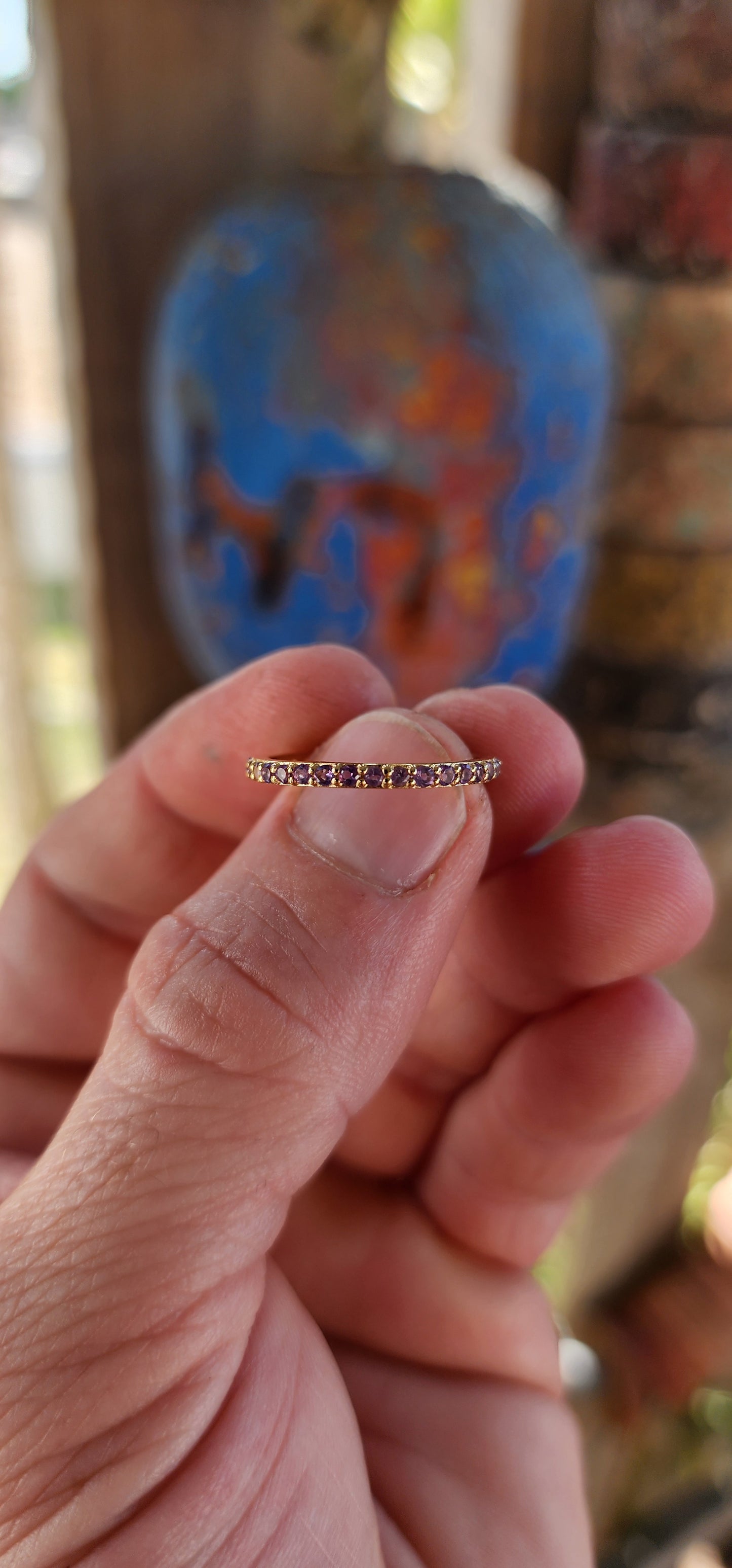 A sterling silver full eternity stacking ring, luxuriously plated in 18ct yellow gold and adorned with a continuous circle of sparkling Purple Amethyst's.