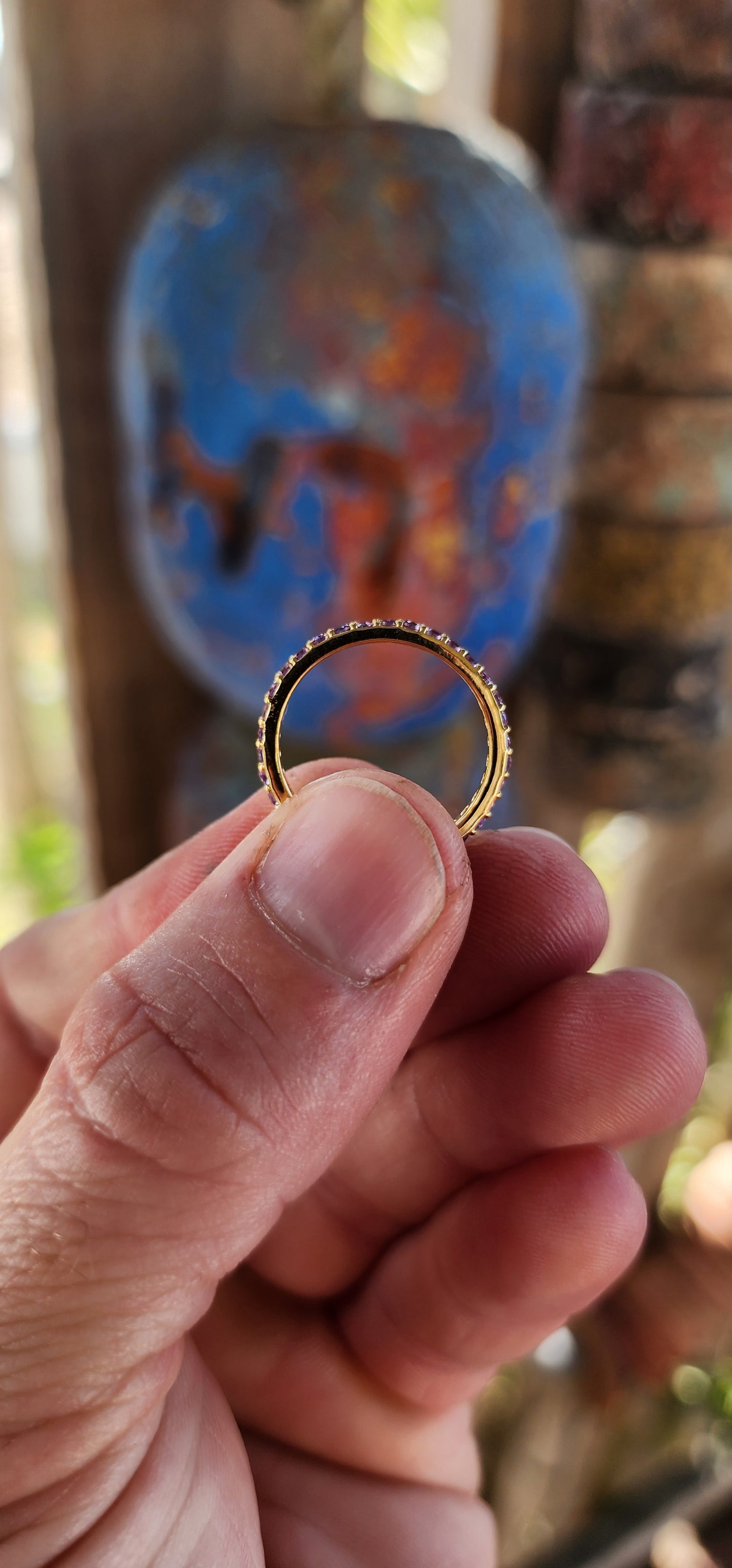 A sterling silver full eternity stacking ring, luxuriously plated in 18ct yellow gold and adorned with a continuous circle of sparkling Purple Amethyst's.