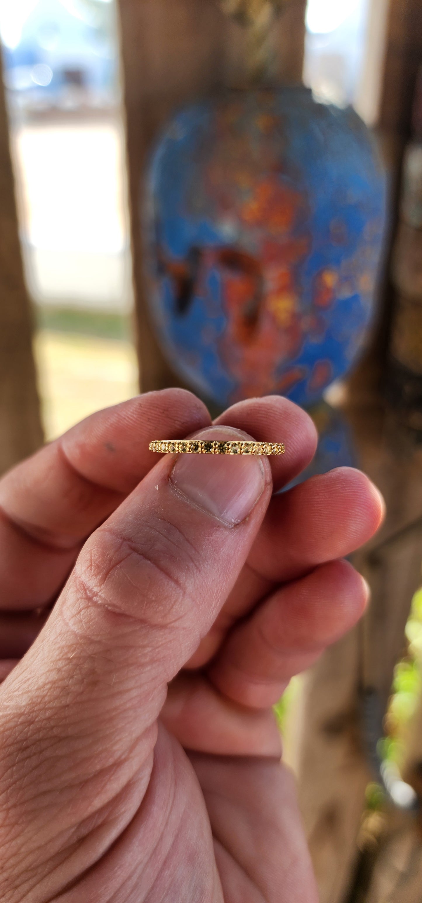 A sterling silver full eternity stacking ring, luxuriously plated in 18ct yellow gold and adorned with a continuous circle of sparkling Yellow Sapphires.