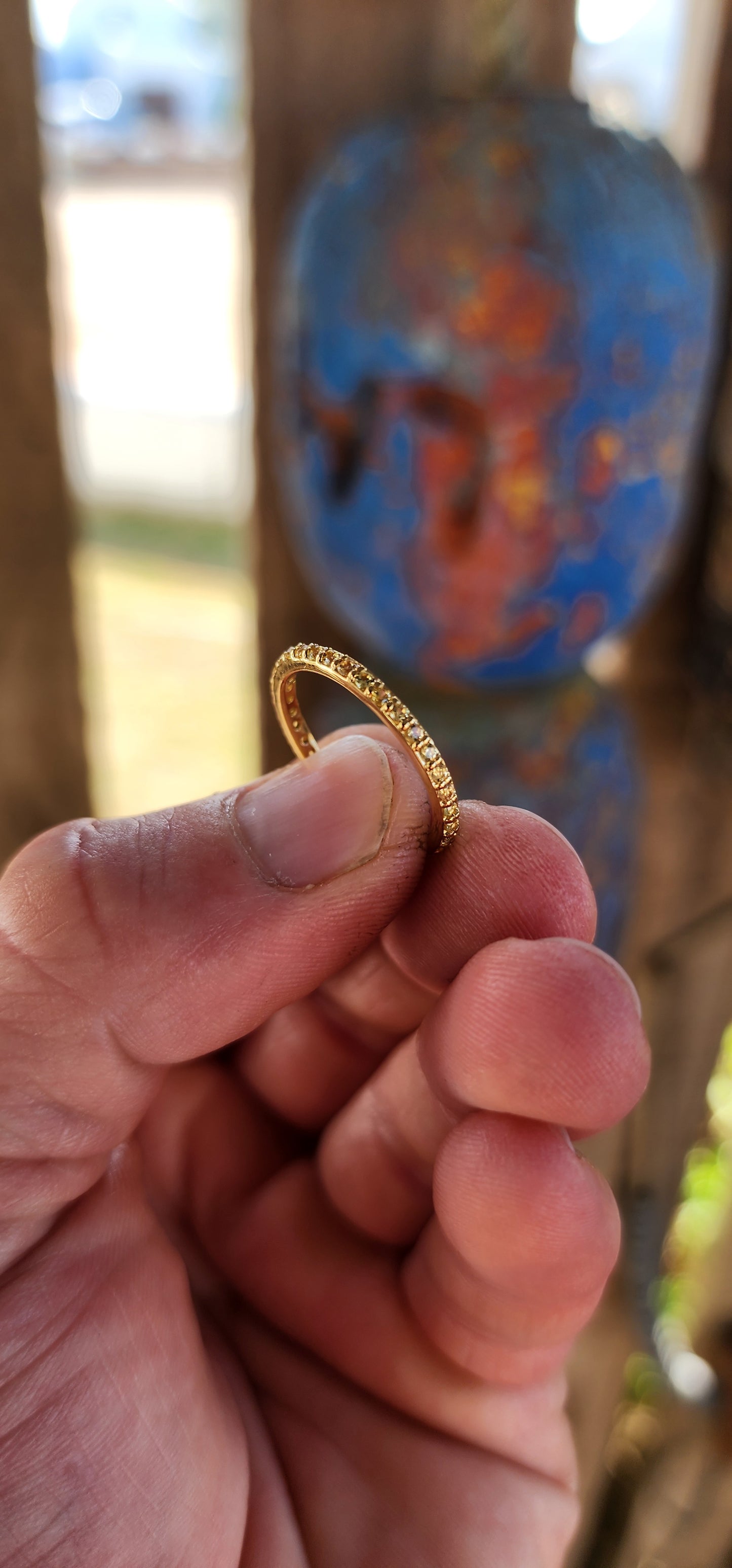 A sterling silver full eternity stacking ring, luxuriously plated in 18ct yellow gold and adorned with a continuous circle of sparkling Yellow Sapphires.