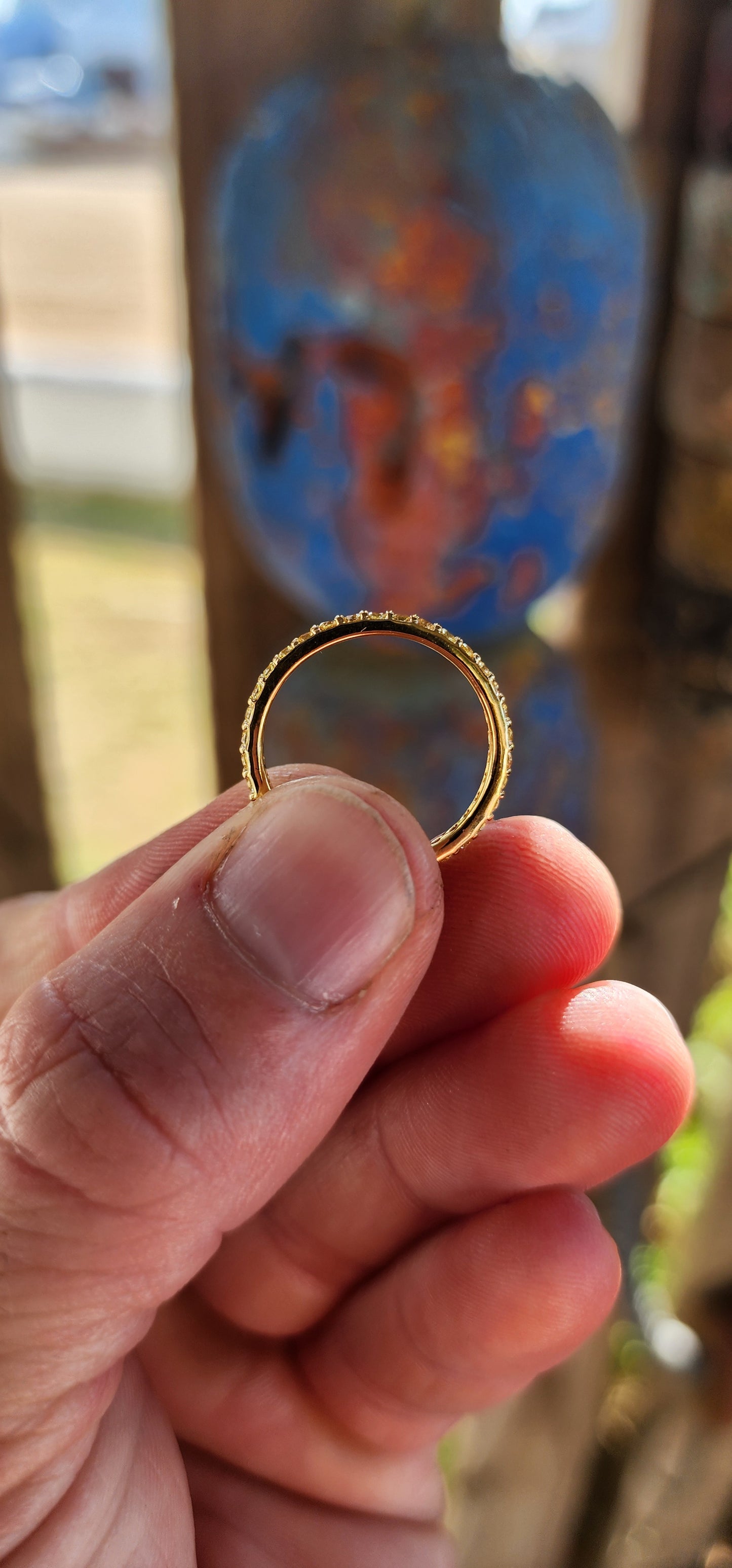 A sterling silver full eternity stacking ring, luxuriously plated in 18ct yellow gold and adorned with a continuous circle of sparkling Yellow Sapphires.