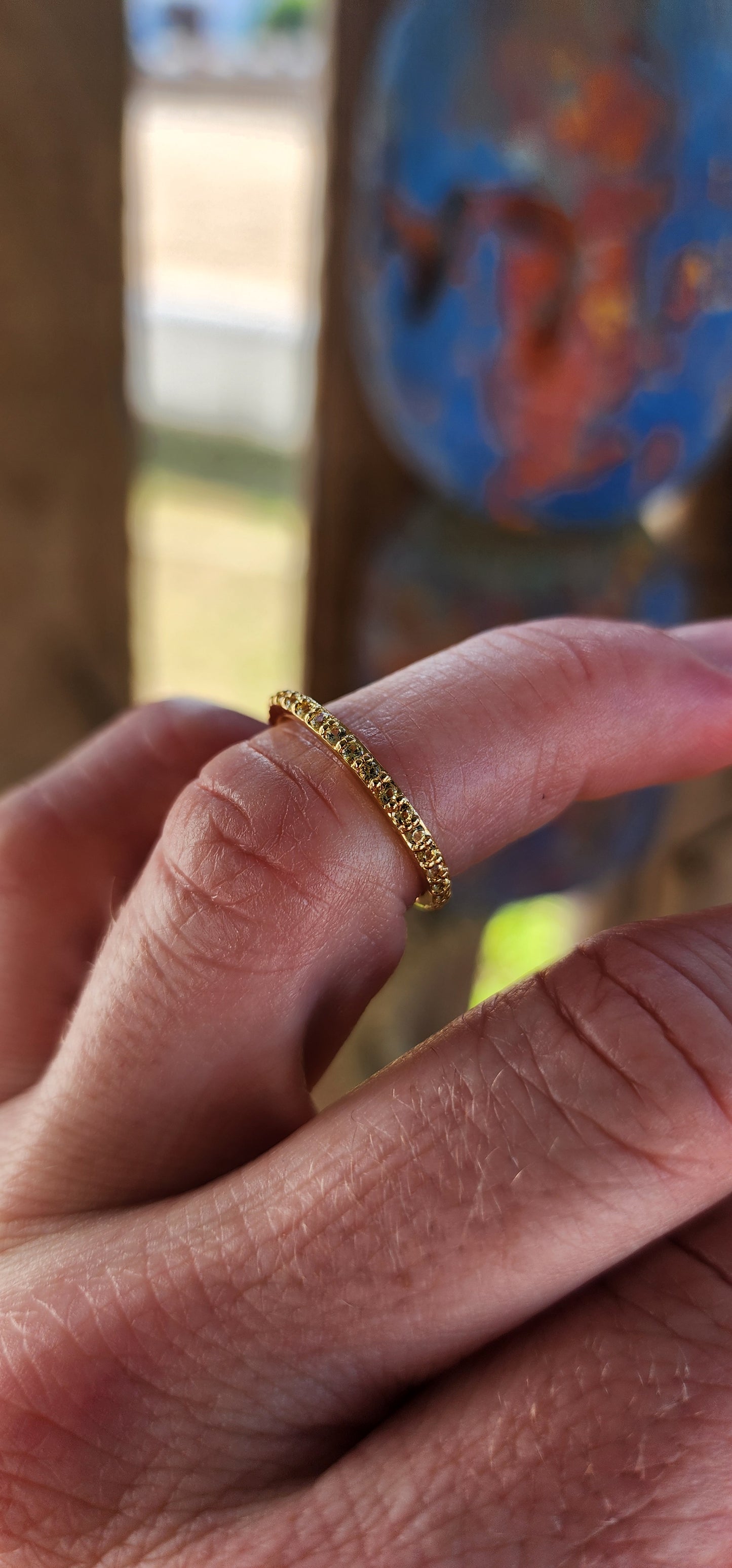 A sterling silver full eternity stacking ring, luxuriously plated in 18ct yellow gold and adorned with a continuous circle of sparkling Yellow Sapphires.