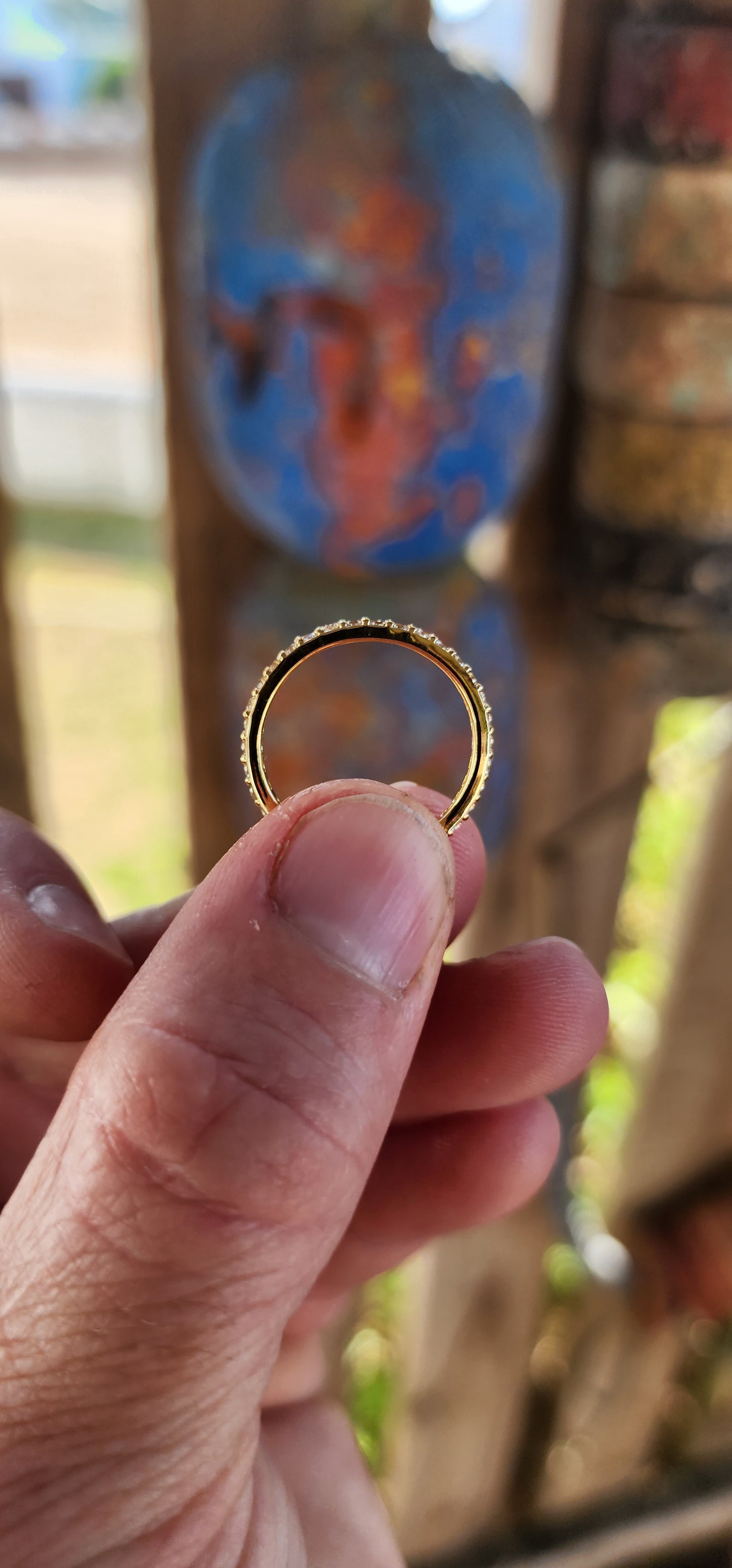 A sterling silver full eternity stacking ring, luxuriously plated in 18ct yellow gold and adorned with a continuous circle of sparkling White Zircons.