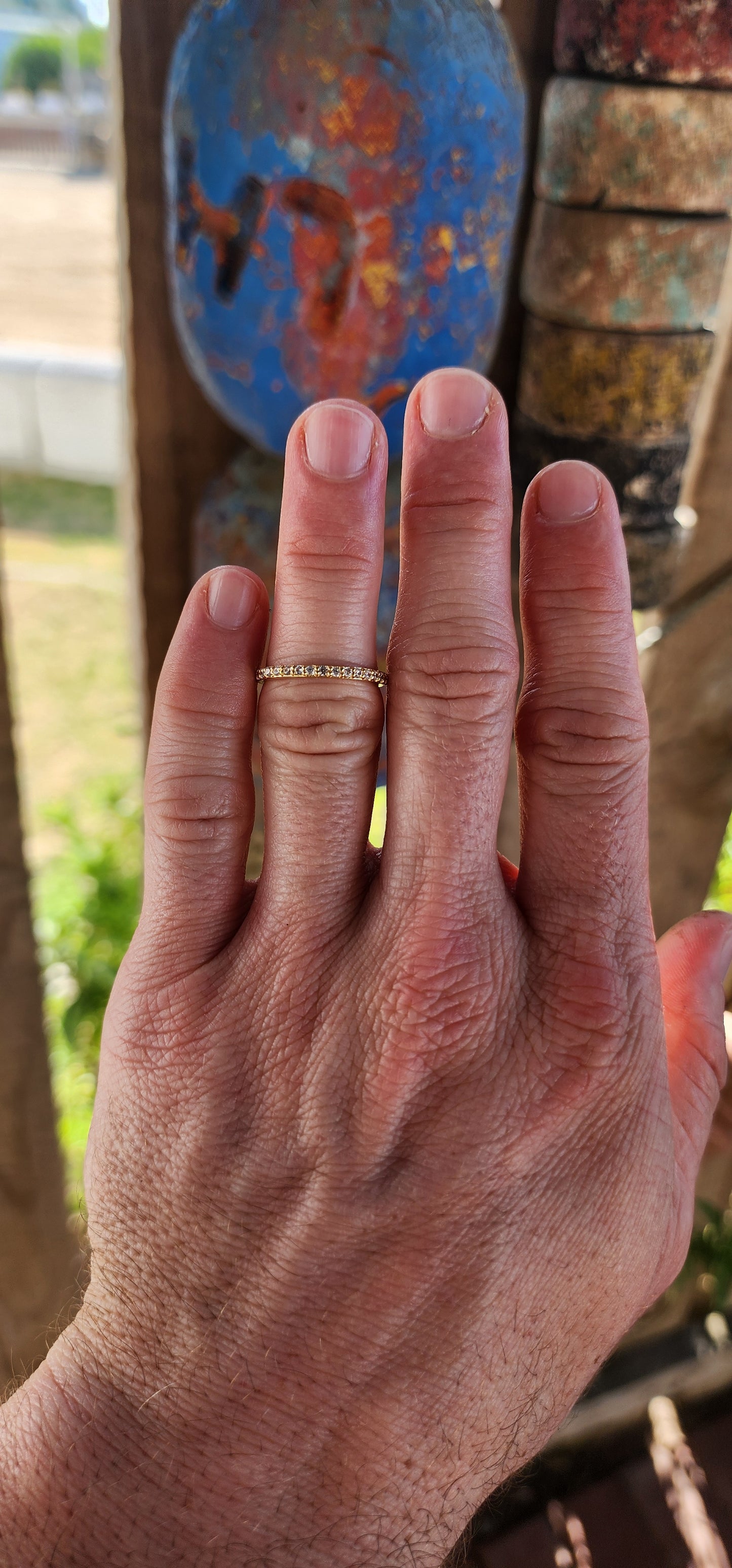A sterling silver full eternity stacking ring, luxuriously plated in 18ct yellow gold and adorned with a continuous circle of sparkling White Zircons.