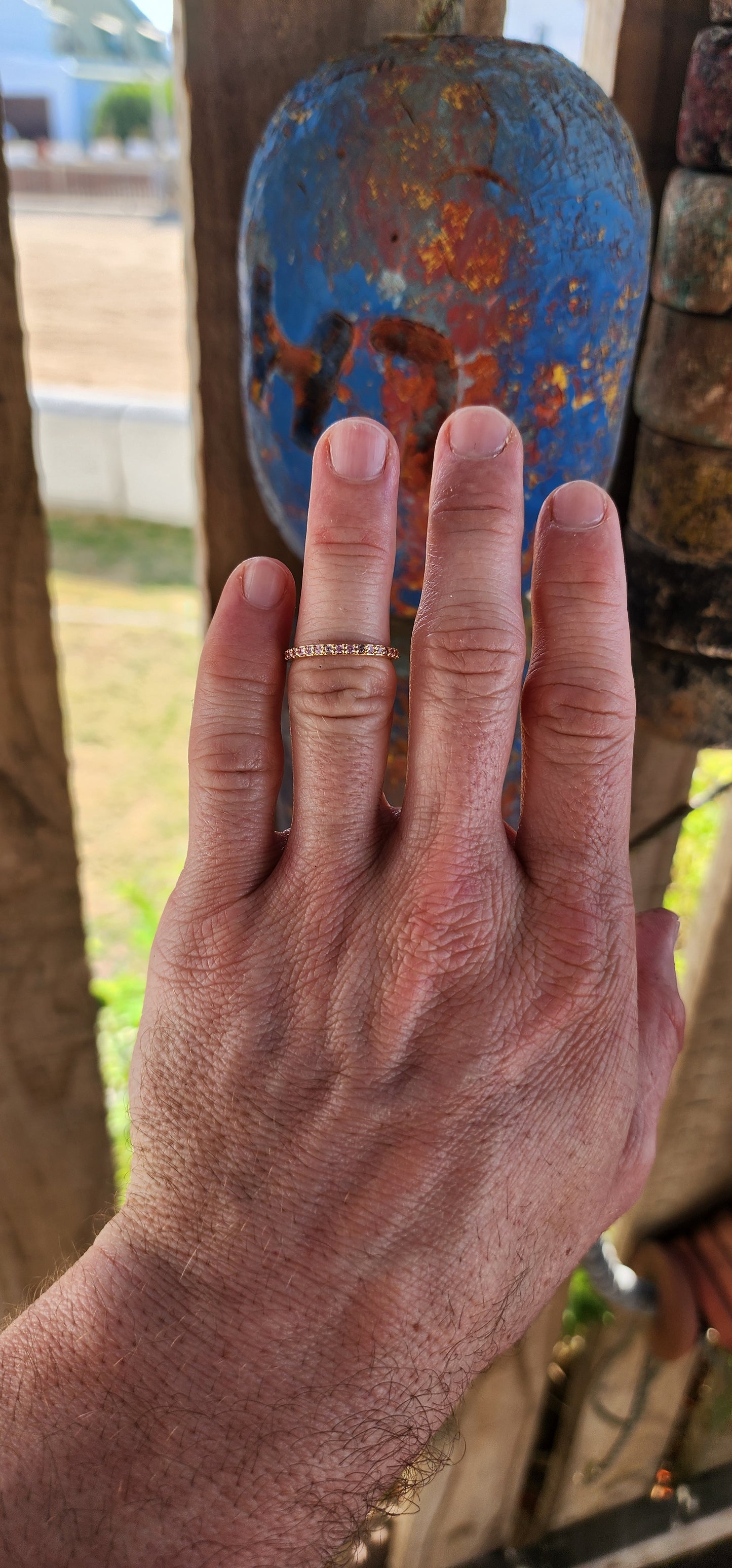 A sterling silver full eternity stacking ring, luxuriously plated in 18ct yellow gold and adorned with a continuous circle of sparkling Pink Sapphires.
