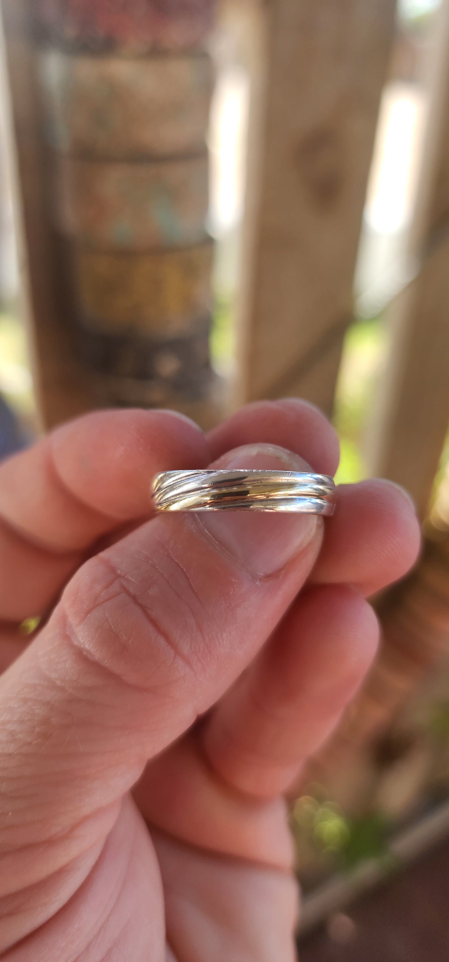 This vintage sterling silver wedding-style band is all about quiet confidence and good design. At first glance it looks classic and understated—but then the details hit.
