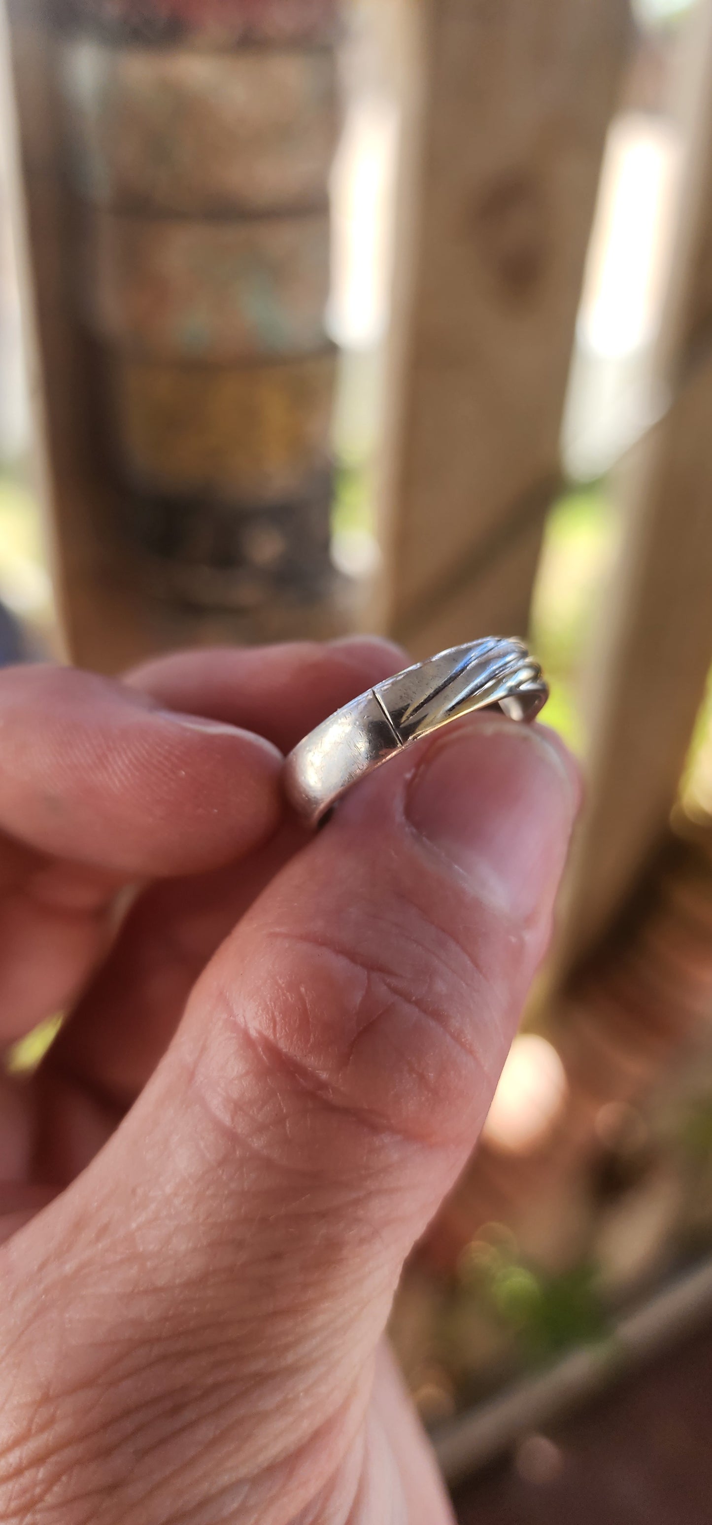 This vintage sterling silver wedding-style band is all about quiet confidence and good design. At first glance it looks classic and understated—but then the details hit.