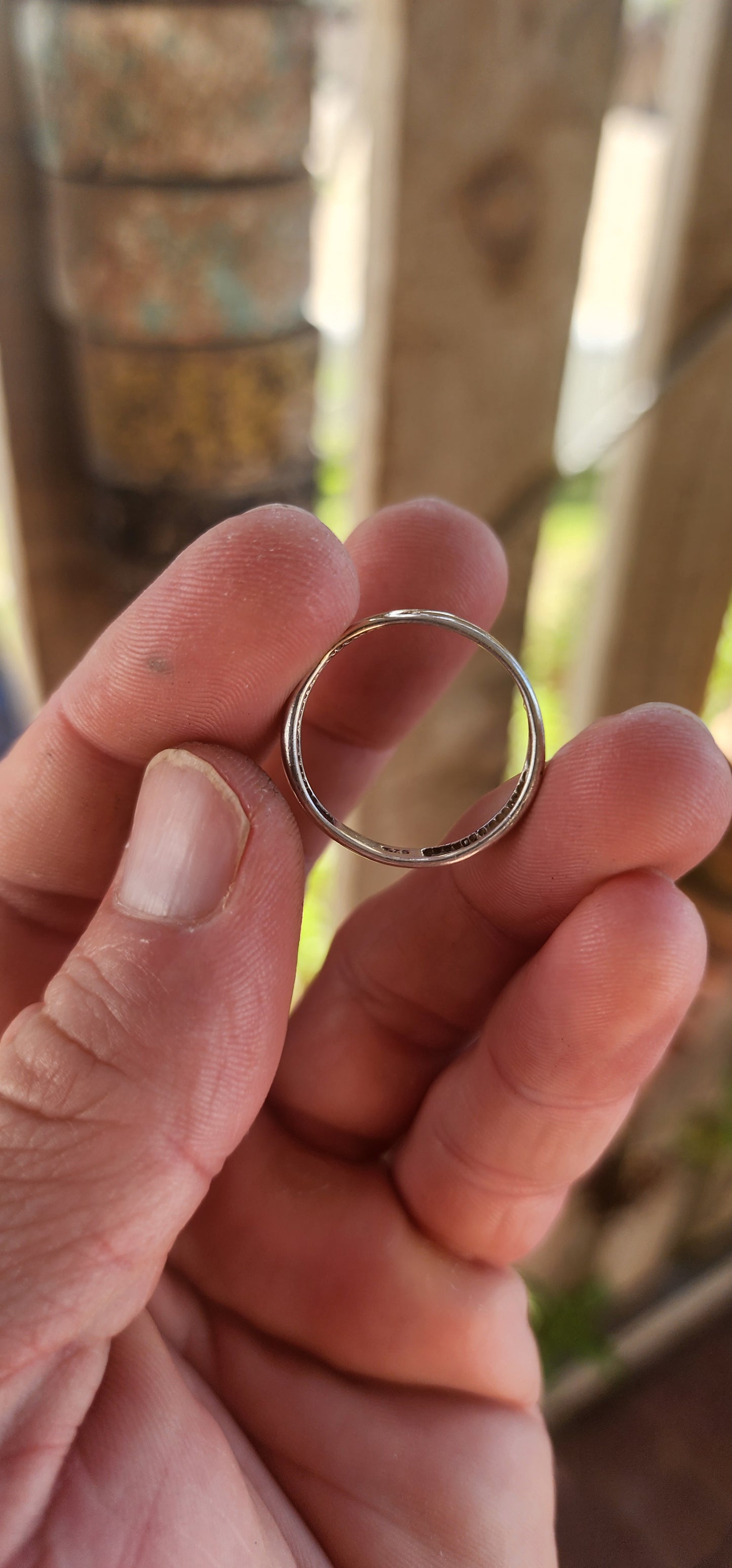 This vintage sterling silver wedding-style band is all about quiet confidence and good design. At first glance it looks classic and understated—but then the details hit.