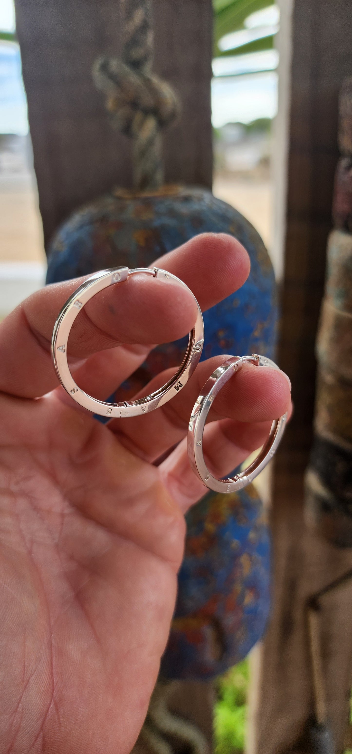 These oversized designer sterling silver hoop earrings are all about confident, no-nonsense glamour with a cool, modern edge.
