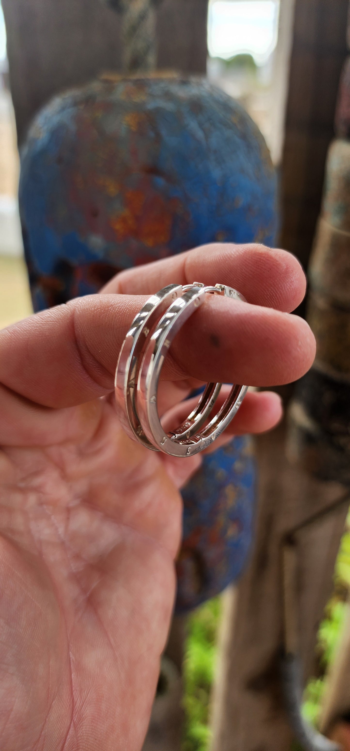 These oversized designer sterling silver hoop earrings are all about confident, no-nonsense glamour with a cool, modern edge.